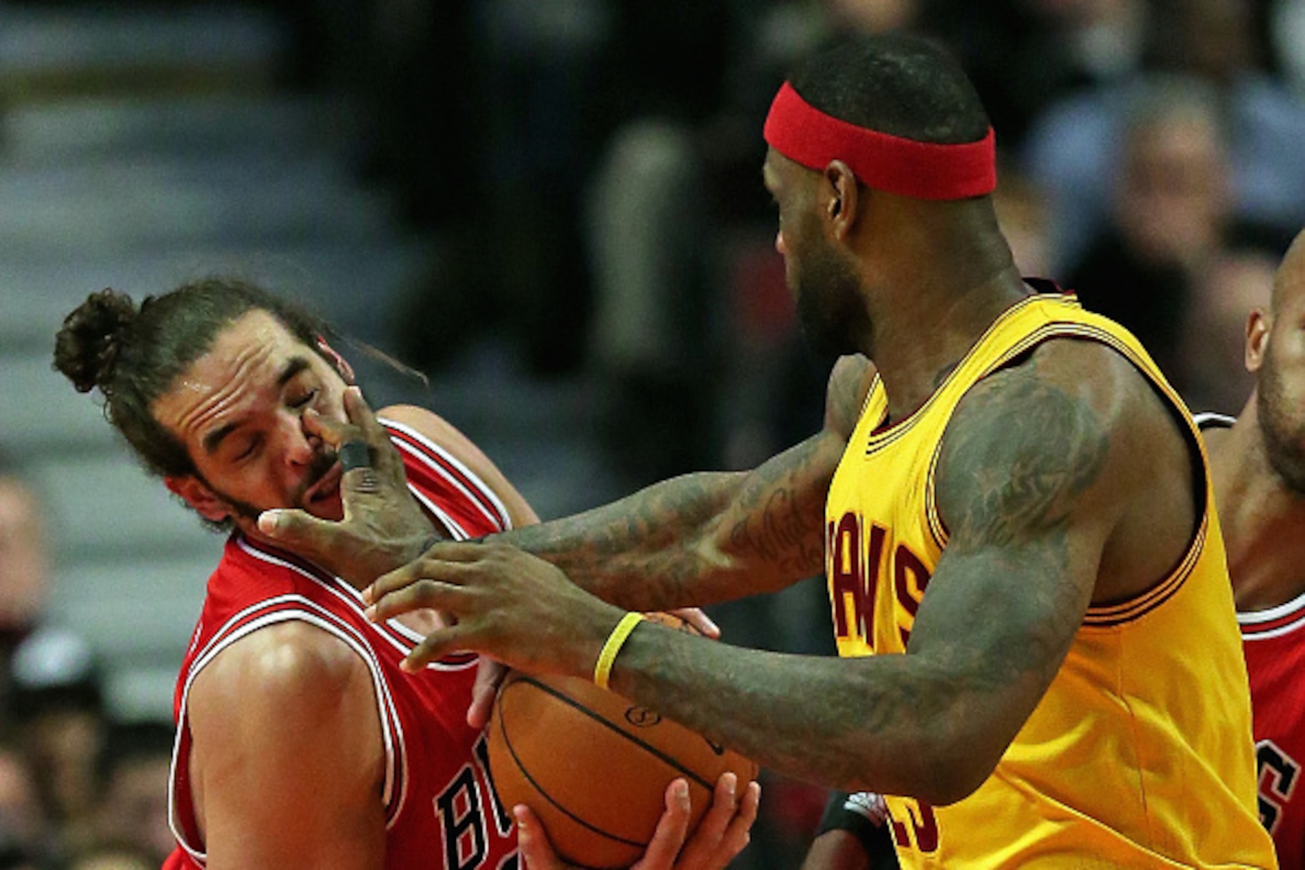 CHICAGO, IL - FEBRUARY 12:  LeBron James #23 of the Cleveland Cavaliers fouls Joakim Noah #13 of the Chicago Bulls at the United Center on February 12, 2015 in Chicago, Illinois. The Bulls defeated the Cavaliers 113-98. NOTE TO USER: User expressly acknow