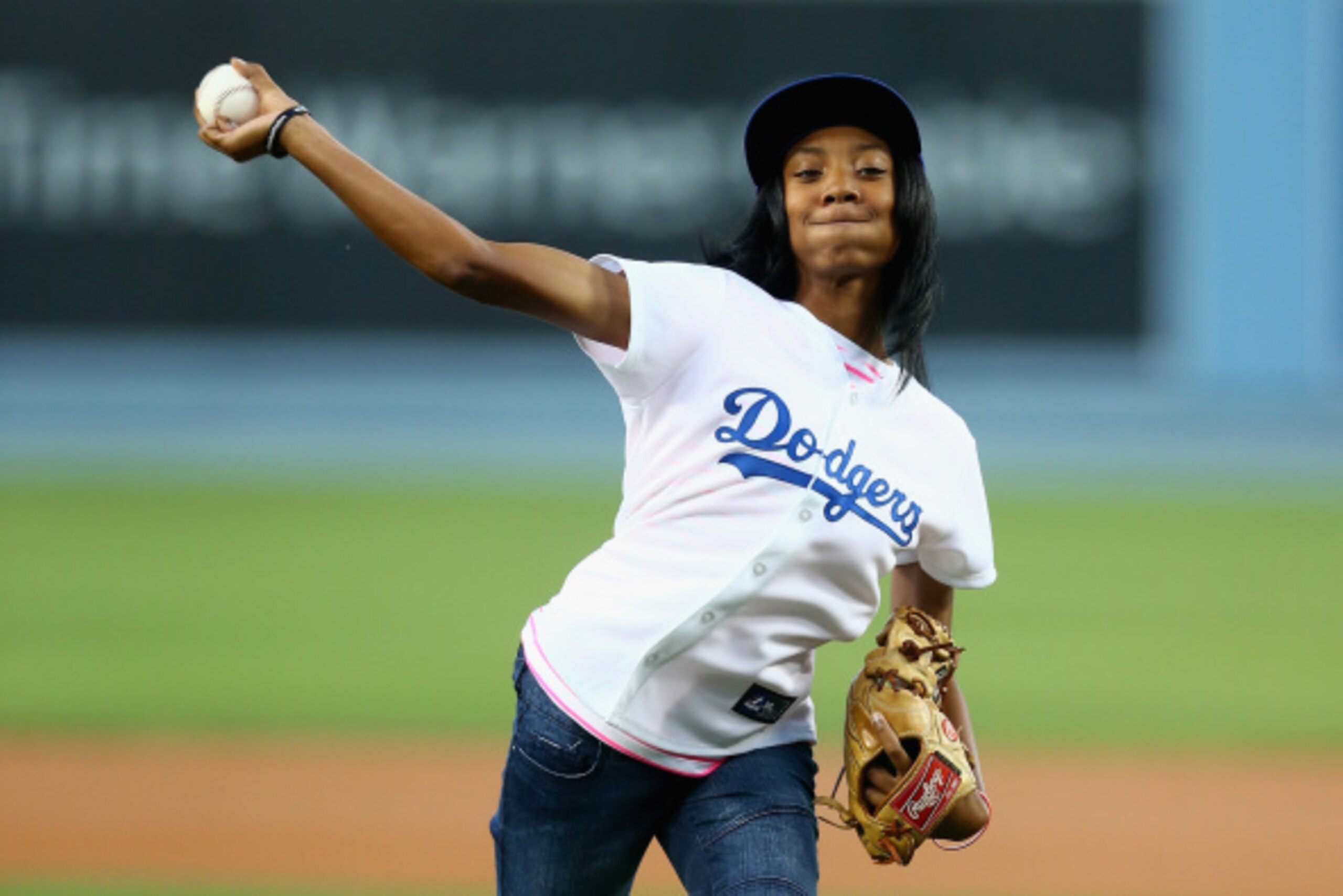 LOS ANGELES, CA - SEPTEMBER 02:  Little League Baseball pitcher Mo'ne Davis throws out the ceremonial first pitch prior to the start of the game between the Los Angeles Dodgers and the Washington Nationals at Dodger Stadium on September 2, 2014 in Los Ang