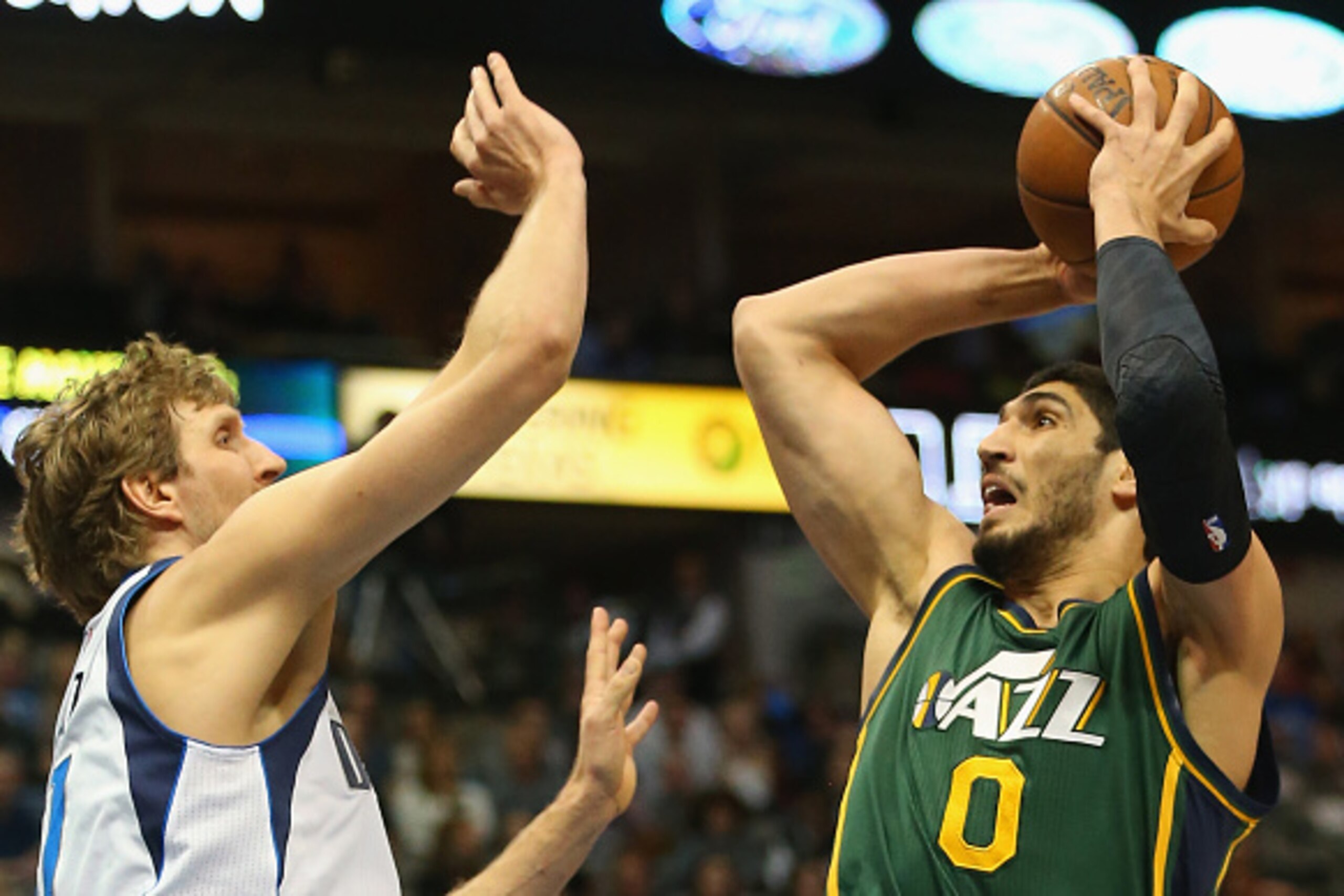 DALLAS, TX - FEBRUARY 11:  Enes Kanter #0 of the Utah Jazz takes a shot against Dirk Nowitzki #41 of the Dallas Mavericks at American Airlines Center on February 11, 2015 in Dallas, Texas.  NOTE TO USER: User expressly acknowledges and agrees that, by dow