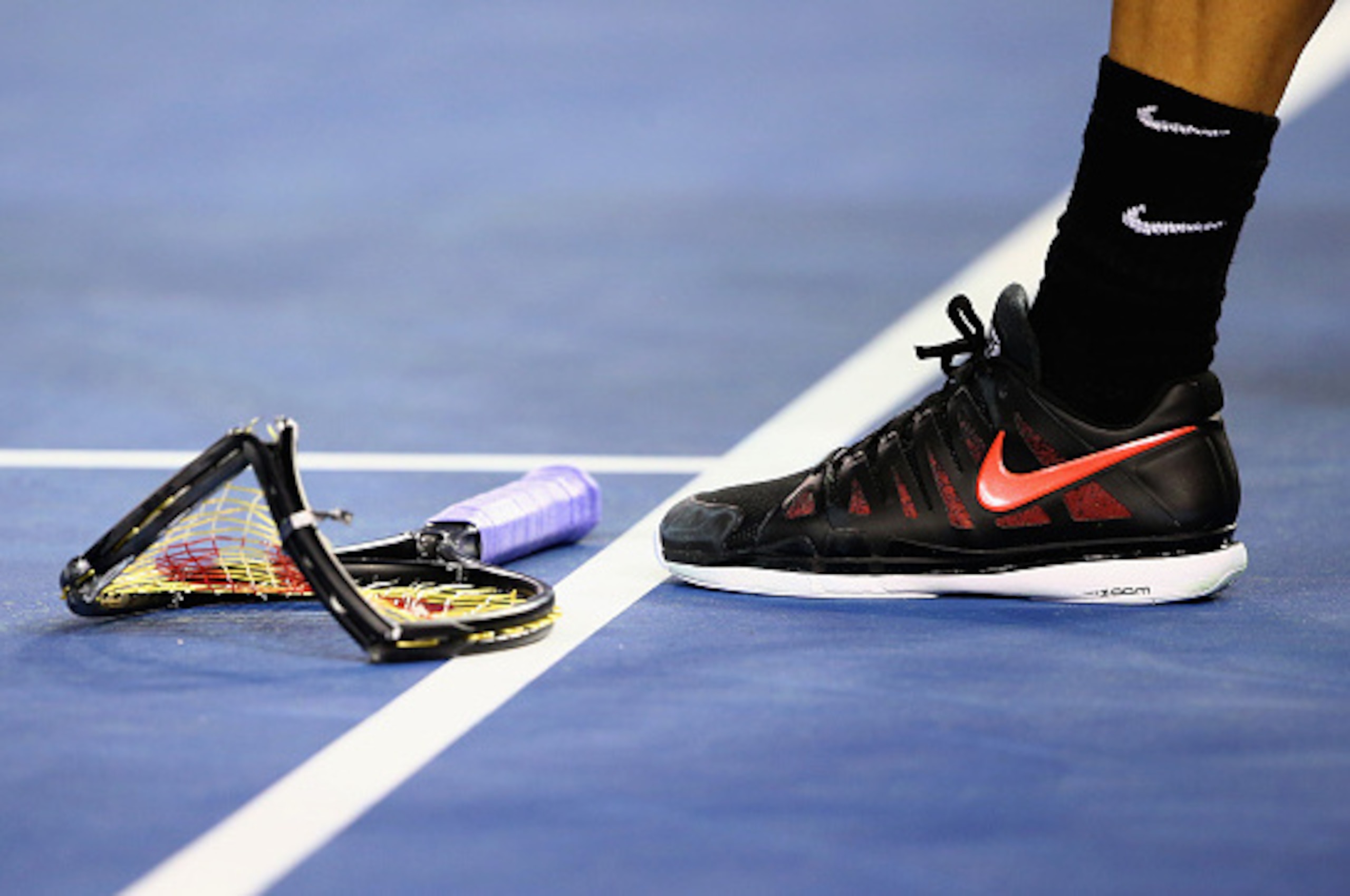 MELBOURNE, AUSTRALIA - JANUARY 25:  Grigor Dimitrov of Bulgaria smashes his racket in his fourth round match against  Andy Murray of Great Britain during day seven of the 2015 Australian Open at Melbourne Park on January 25, 2015 in Melbourne, Australia.