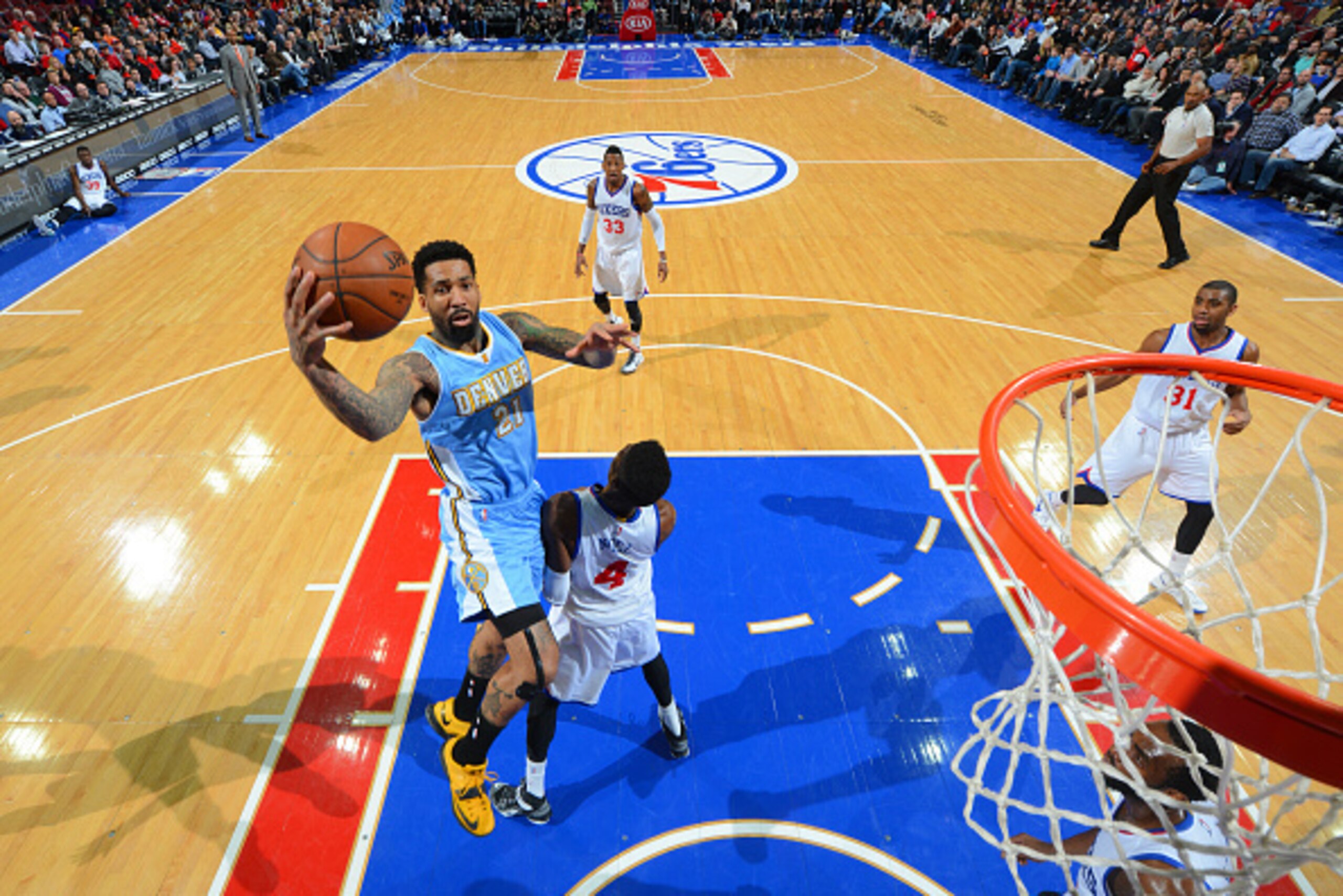 PHILADELPHIA, PA - FEBRUARY 3: Wilson Chandler #21 of the Denver Nuggets goes up for the layup against the Philadelphia 76ers at Wells Fargo Center on February 3, 2015 in Philadelphia, Pennsylvania NOTE TO USER: User expressly acknowledges and agrees tha PHILADELPHIA, PA - FEBRUARY 3: Wilson Chandler #21 of the Denver Nuggets goes up for the layup against the Philadelphia 76ers at Wells Fargo Center on February 3, 2015 in Philadelphia, Pennsylvania NOTE TO USER: User expressly acknowledges and agrees tha