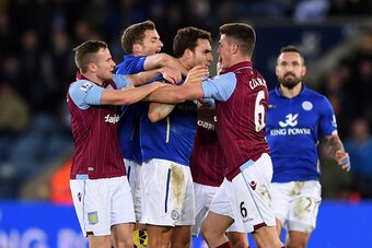 LEICESTER, ENGLAND - JANUARY 10:  Ciaran Clark #6 of Aston Villa and Matthew James #'8 of Leicester City clash following a rash tackle on Jores Okore of Aston Villa during the Barclays Premier League match between Leicester City and Aston Villa at The Kin