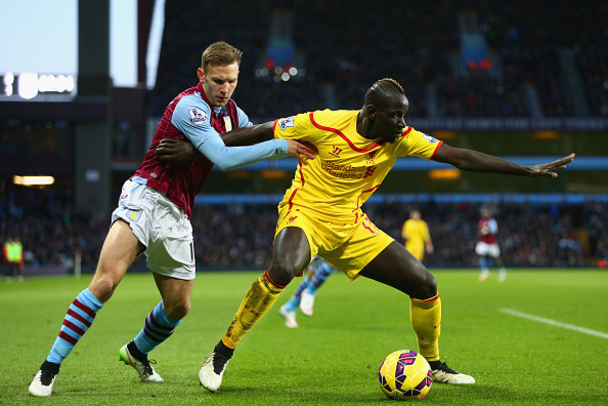 BIRMINGHAM, ENGLAND - JANUARY 17:  Mamadou Sakho of Liverpool holds off Andreas Weimann of Aston Villa during the Barclays Premier League match between Aston Villa and Liverpool at Villa Park on January 17, 2015 in Birmingham, England.  (Photo by Clive Ma