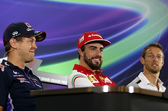 ABU DHABI, UNITED ARAB EMIRATES - NOVEMBER 20:  (L-R) Sebastian Vettel of Germany and Infiniti Red Bull Racing, Fernando Alonso of Spain and Ferrari and Jenson Button of Great Britain and McLaren look on during the srivers' press conference during preview