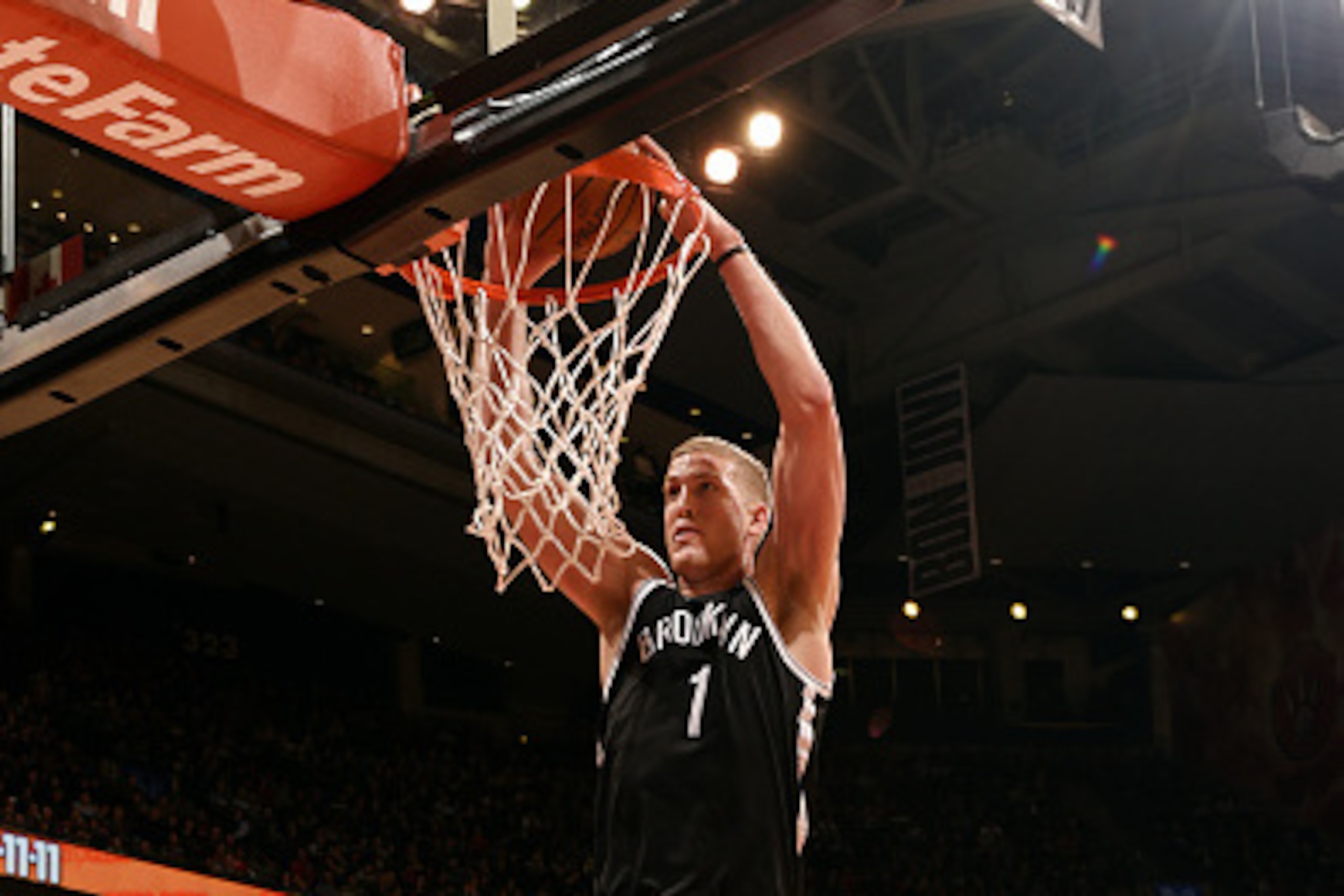 TORONTO, ON - FEBRUARY 4: Mason Plumlee #1 of the Brooklyn Nets dunks against the Toronto Raptors on February 4, 2015 at the Air Canada Centre in Toronto, Ontario, Canada. NOTE TO USER: User expressly acknowledges and agrees that, by downloading and or us