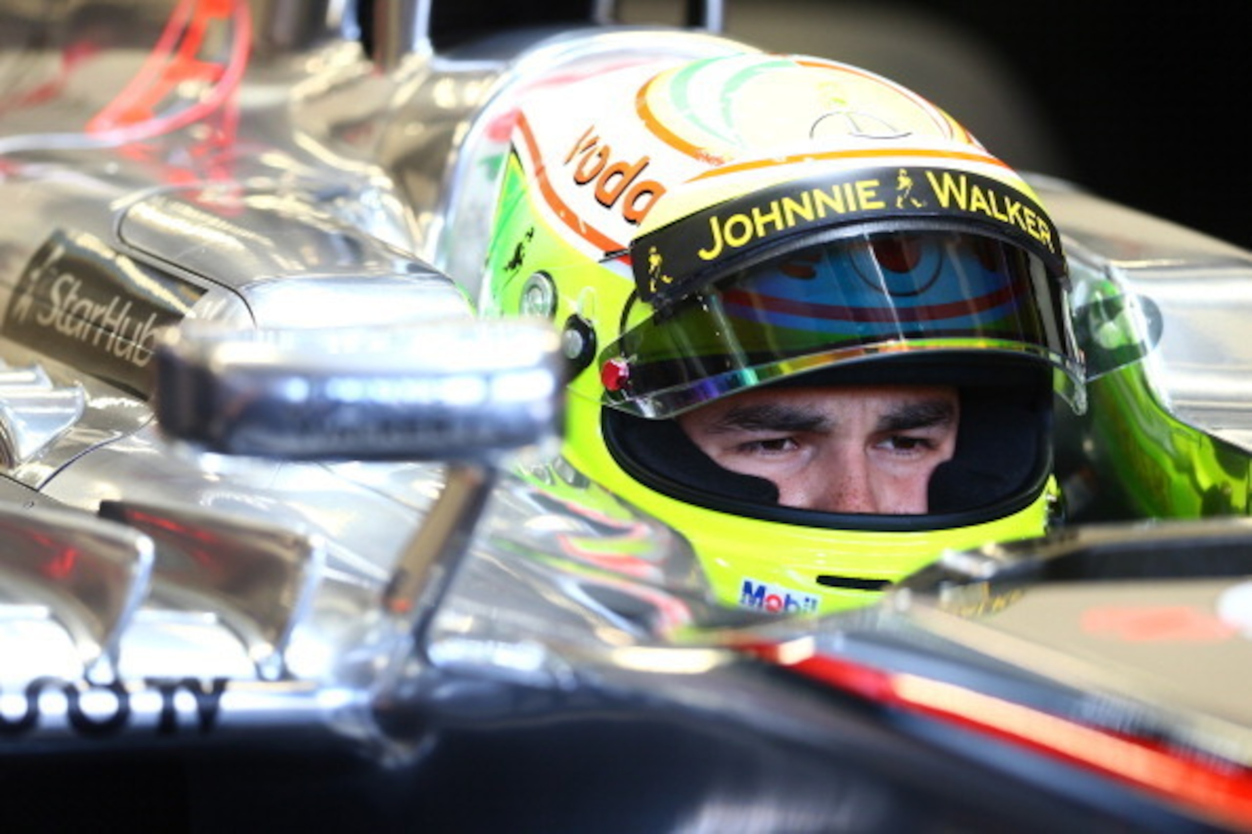 SINGAPORE - SEPTEMBER 21: Sergio Perez of Mexico and McLaren prepares to drive during final practice ahead of qualifying for the Singapore Formula One Grand Prix at Marina Bay Street Circuit on September 21, 2013 in Singapore, Singapore.