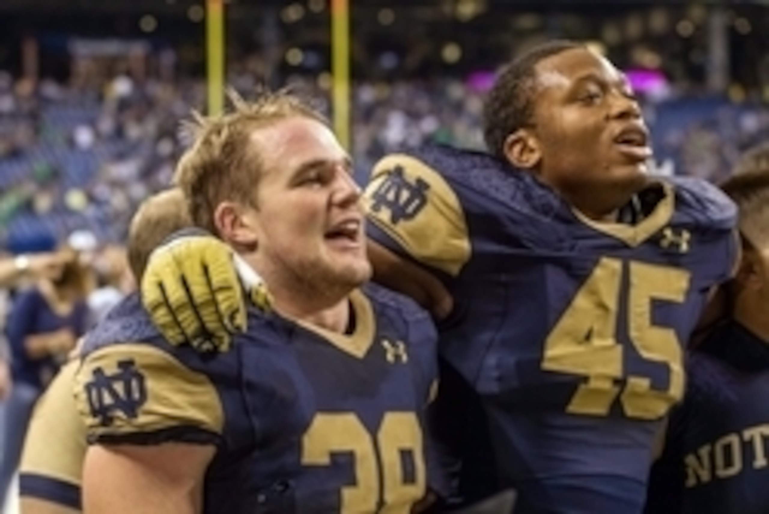 Sep 13, 2014; Indianapolis, IN, USA; Notre Dame Fighting Irish linebacker Joe Schmidt (38) and linebacker Romeo Okwara (45) sing the Alma Mater after Notre Dame defeated the Purdue Boilermakers 30-14 at Lucas Oil Stadium. Mandatory Credit: Matt Cashore-US Sep 13, 2014; Indianapolis, IN, USA; Notre Dame Fighting Irish linebacker Joe Schmidt (38) and linebacker Romeo Okwara (45) sing the Alma Mater after Notre Dame defeated the Purdue Boilermakers 30-14 at Lucas Oil Stadium. Mandatory Credit: Matt Cashore-US