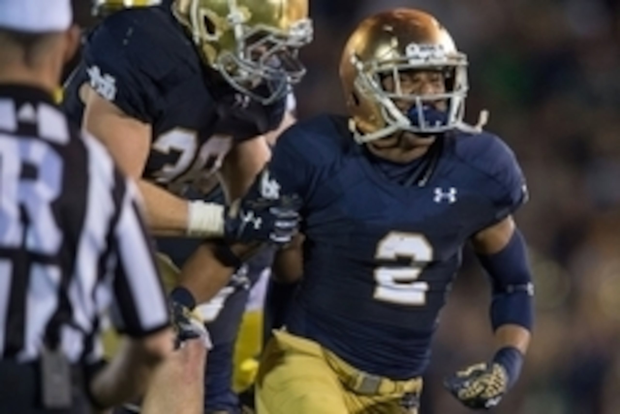 Sep 6, 2014; South Bend, IN, USA; Notre Dame Fighting Irish cornerback Cody Riggs (2) celebrates with linebacker Joe Schmidt (38) after an interception in the fourth quarter against the Michigan Wolverines at Notre Dame Stadium. Notre Dame won 31-0. Manda Sep 6, 2014; South Bend, IN, USA; Notre Dame Fighting Irish cornerback Cody Riggs (2) celebrates with linebacker Joe Schmidt (38) after an interception in the fourth quarter against the Michigan Wolverines at Notre Dame Stadium. Notre Dame won 31-0. Manda