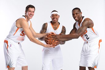 PHOENIX, AZ - SEPTEMBER 29: Goran Dragic #1,  Isaiah Thomas #3 and Eric Bledsoe #2 of the Phoenix Suns pose for a photo during Phoenix Suns Media Day on September 29, 2014 at U.S. Airways Center in Phoenix, Arizona. NOTE TO USER: User expressly acknowledg