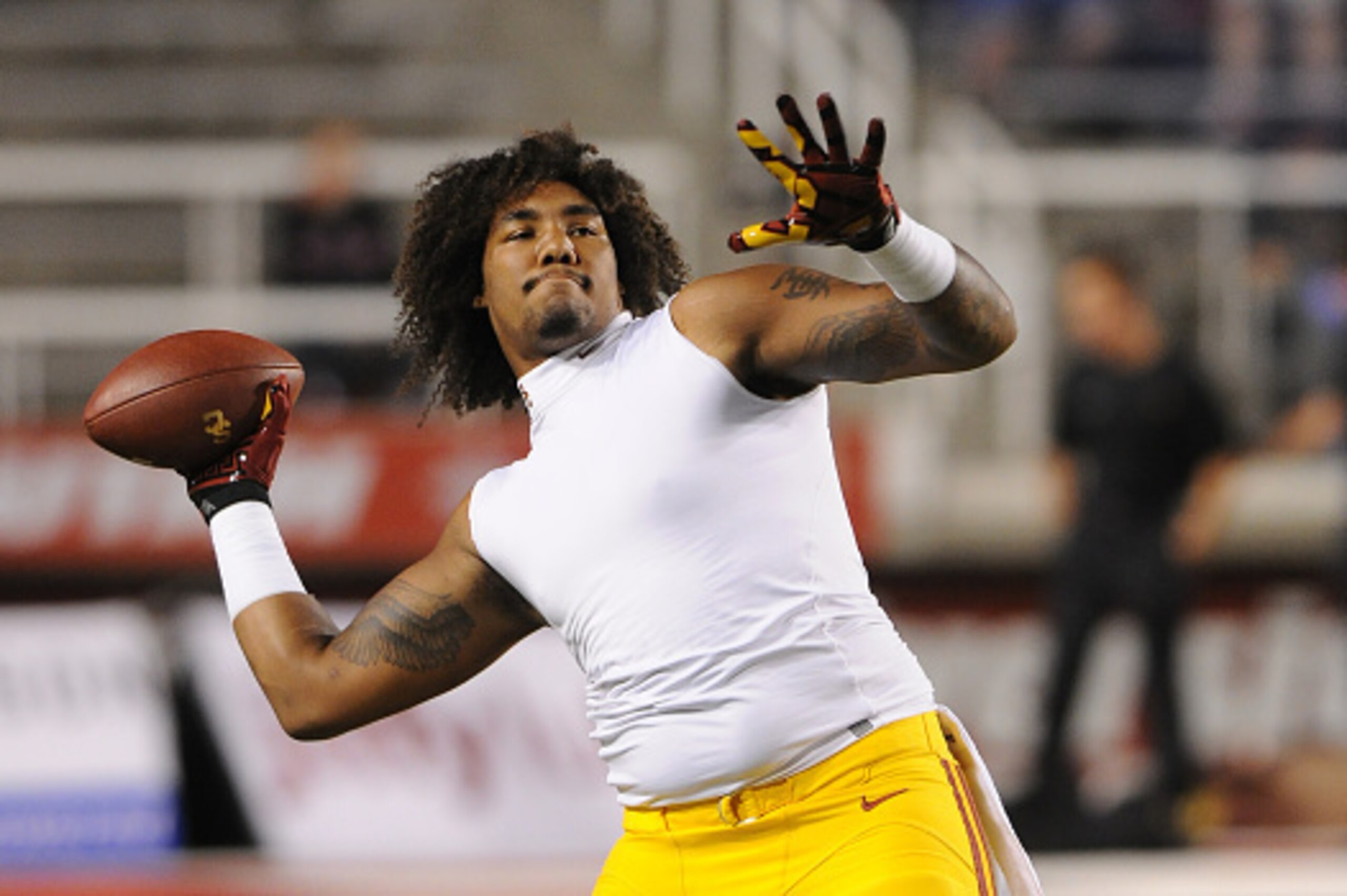 SALT LAKE CITY, UT - OCTOBER 25: Defensive end Leonard Williams #94 of the USC Trojans plays catch before their game against the Utah Utes at Rice-Eccles Stadium on October 25, 2014 in Salt Lake City, Utah. (Photo by Gene Sweeney Jr/Getty Images )