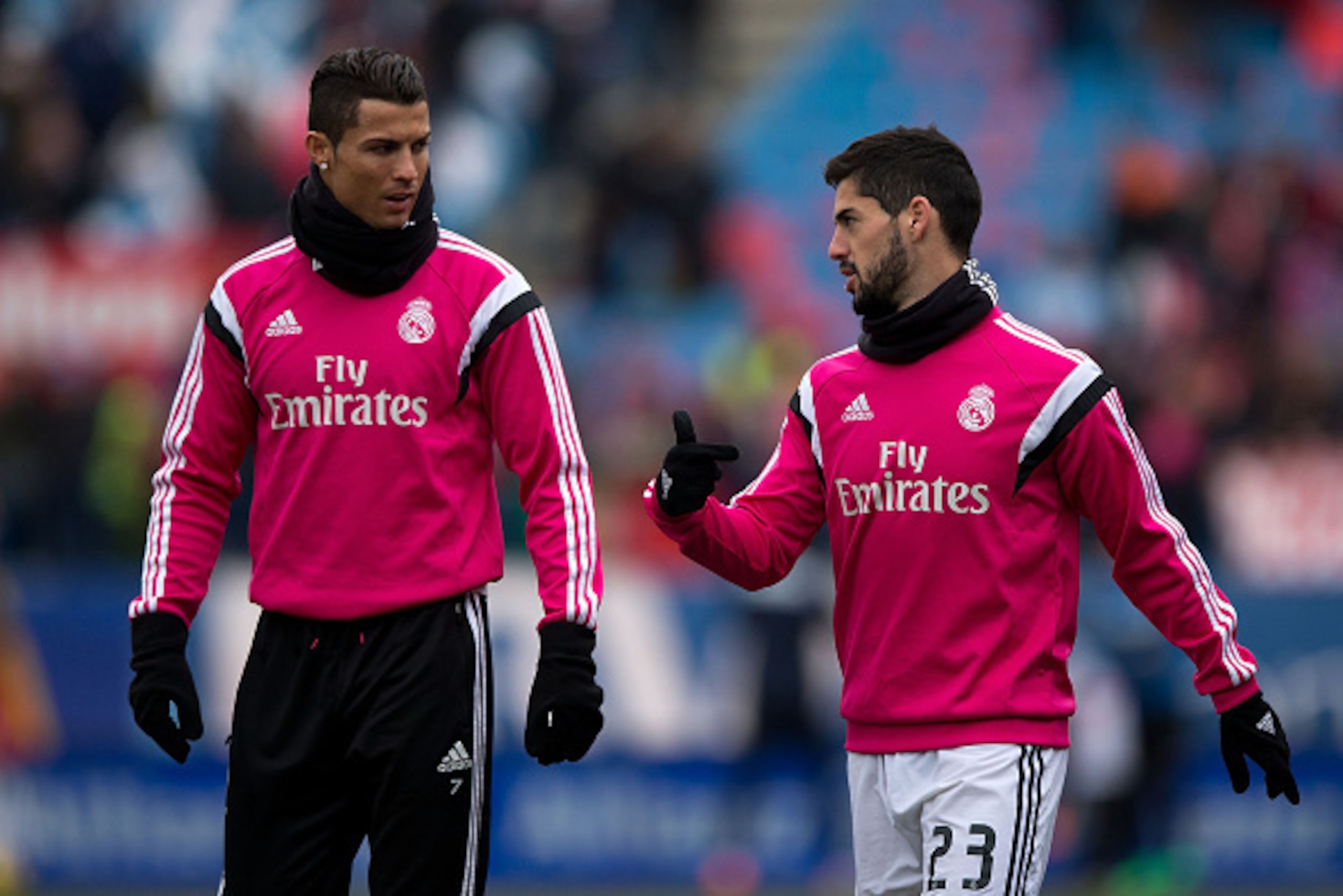 MADRID, SPAIN - FEBRUARY 07: Cristiano Ronaldo (L) of Real Madrid CF speaks with his teammate Francisco Roman Alarcon alias Isco (R)during the warming up before the La Liga match between Club Atletico de Madrid and Real Madrid CF at Vicente Calderon Stad MADRID, SPAIN - FEBRUARY 07: Cristiano Ronaldo (L) of Real Madrid CF speaks with his teammate Francisco Roman Alarcon alias Isco (R)during the warming up before the La Liga match between Club Atletico de Madrid and Real Madrid CF at Vicente Calderon Stad