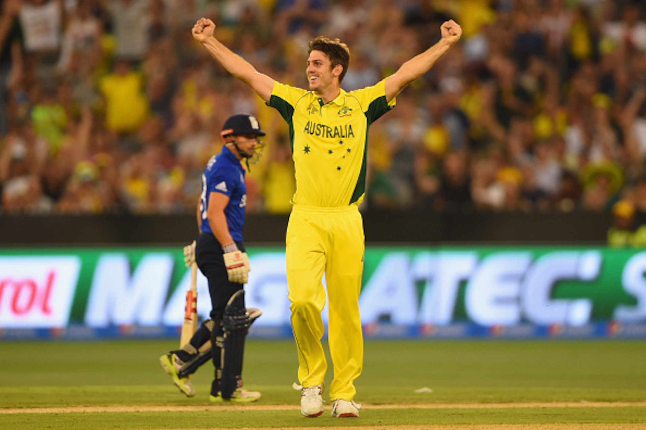 MELBOURNE, AUSTRALIA - FEBRUARY 14:  Mitchell Marsh of Australia celebrates with team-mates Steve after taking his fifth wicket of England's Jos Buttler during the 2015 ICC Cricket World Cup match between England and Australia at Melbourne Cricket Ground 