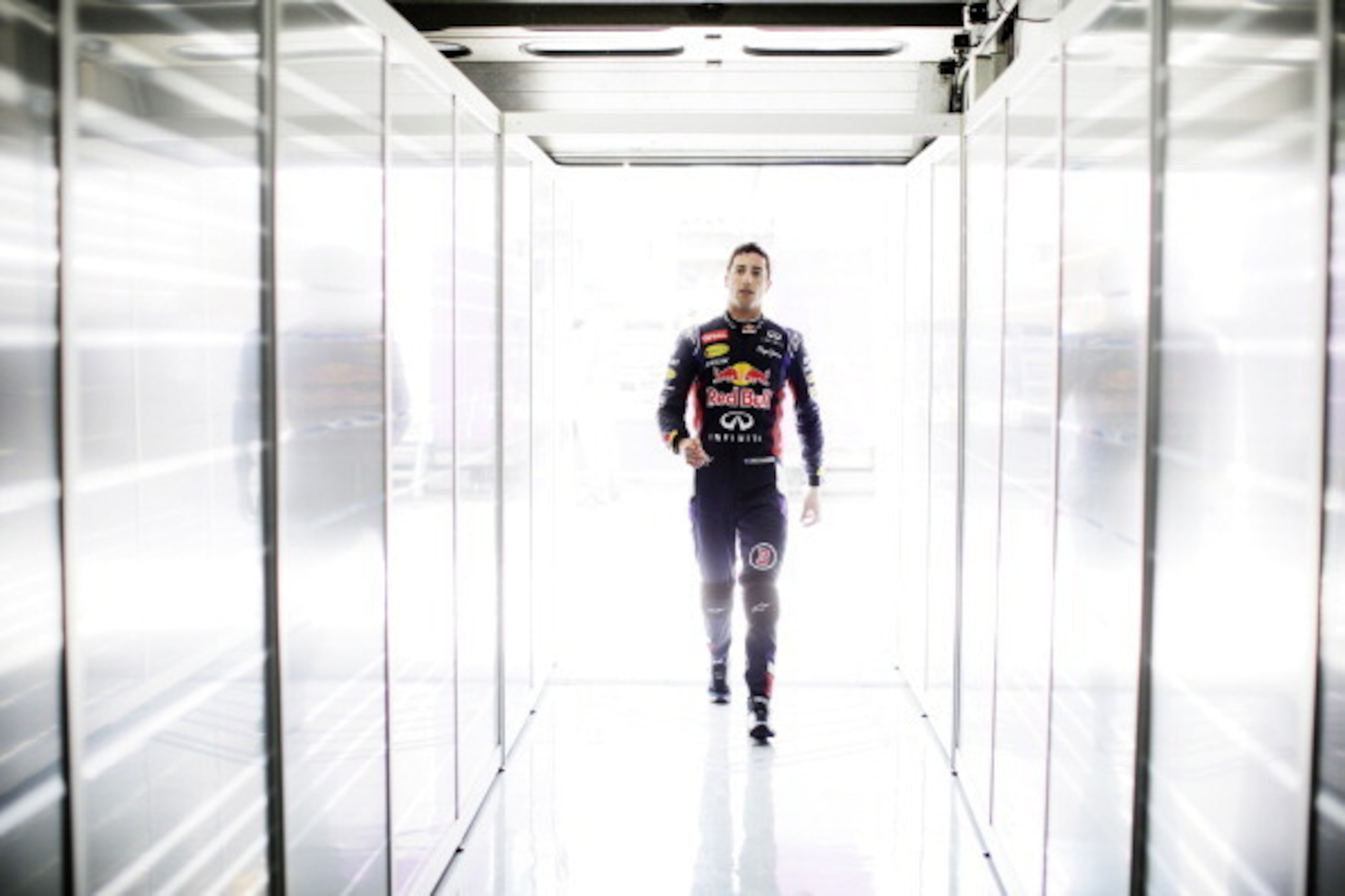 HOCKENHEIM, GERMANY - JULY 18:  Daniel Ricciardo of Australia and Infiniti Red Bull Racing walks into the garage during practice ahead of the German Grand Prix at Hockenheimring on July 18, 2014 in Hockenheim, Germany.  (Photo by Adam Pretty/Getty Images)