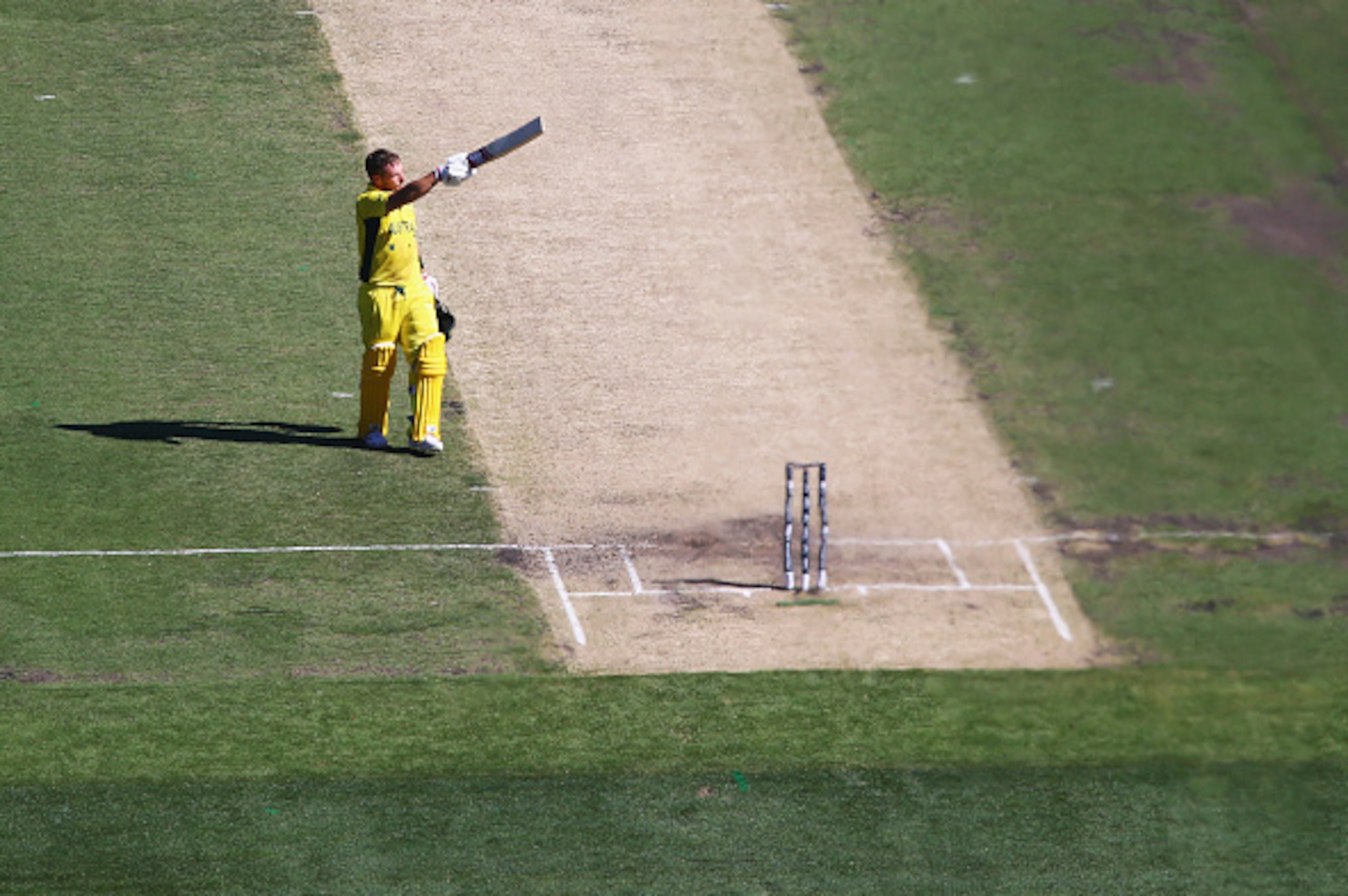 MELBOURNE, AUSTRALIA - FEBRUARY 14:  Aaron Finch of Australia celebrates after reaching his century during the 2015 ICC Cricket World Cup match between England and Australia at Melbourne Cricket Ground on February 14, 2015 in Melbourne, Australia.  (Photo