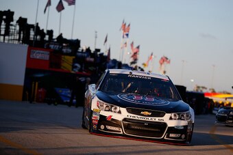 DAYTONA BEACH, FL - FEBRUARY 13: Kevin Harvick, driver of the #4 Jimmy John's/Budweiser Chevrolet, drives through the garage area practice for the NASCAR Sprint Cup Series 3rd Annual Sprint Unlimited at Daytona International Speedway on February 13, 2015 