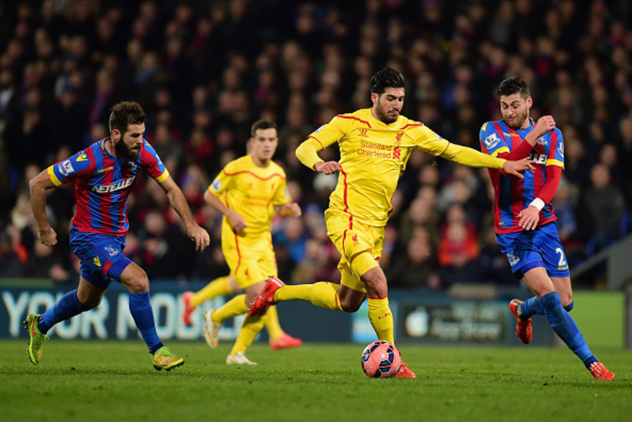 LONDON, ENGLAND - FEBRUARY 14:  Emre Can of Liverpool breaks through Joe Ledley and Joel Ward of Crystal Palace during the FA Cup fifth round match between Crystal Palace and Liverpool at Selhurst Park on February 14, 2015 in London, England.  (Photo by J