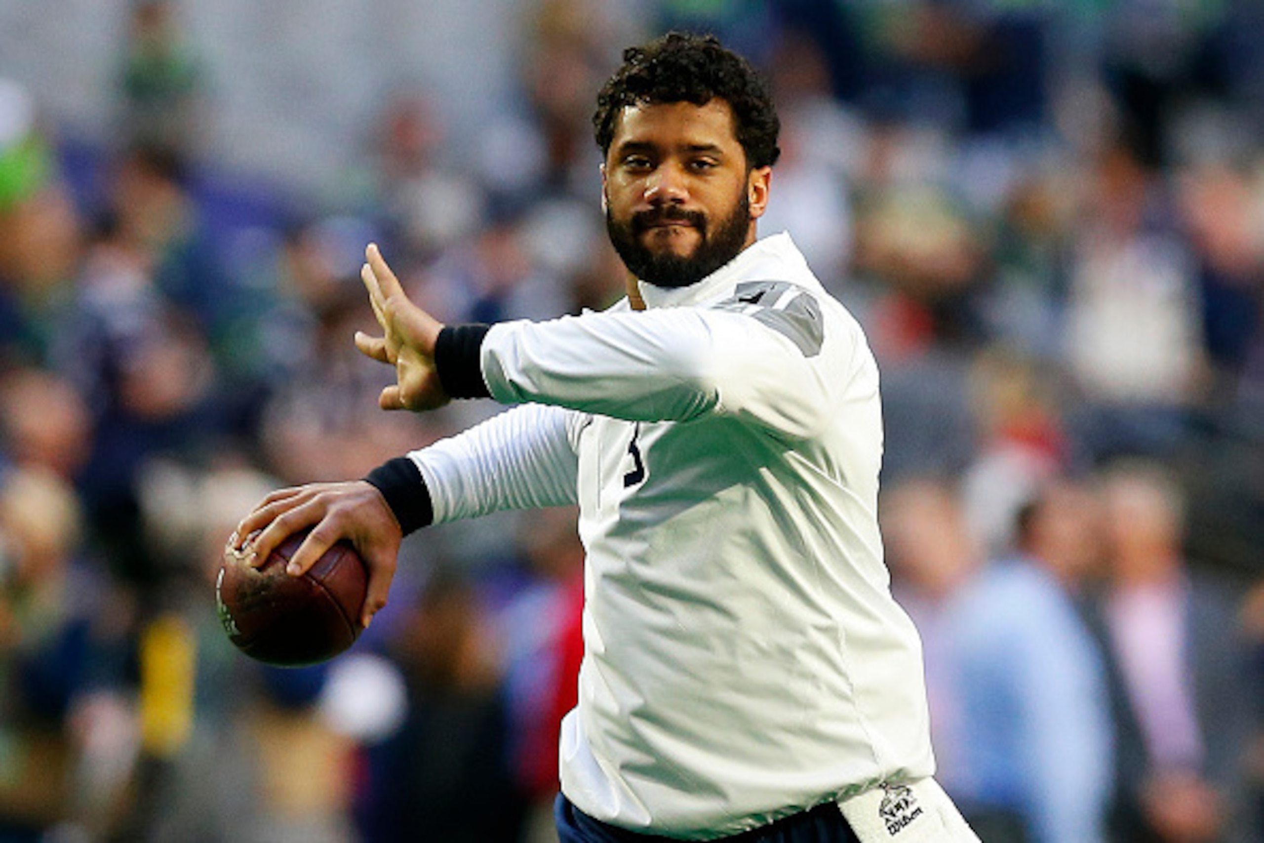 GLENDALE, AZ - FEBRUARY 01:  Russell Wilson #3 of the Seattle Seahawks warms up on the field prior to Super Bowl XLVIII at University of Phoenix Stadium on February 1, 2015 in Glendale, Arizona.  (Photo by Tom Pennington/Getty Images)