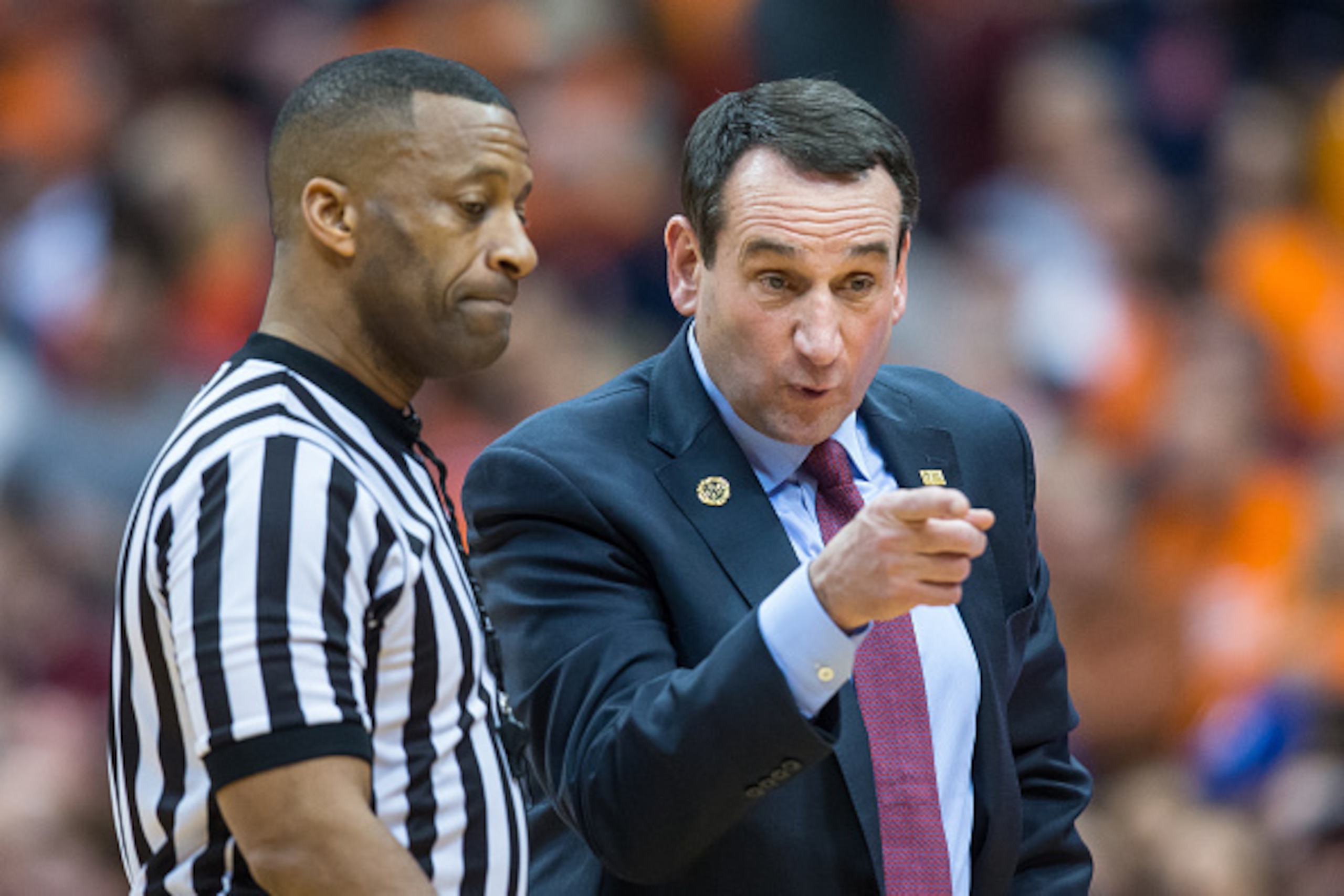SYRACUSE, NY - FEBRUARY 14: Head coach Mike Krzyzewski of the Duke Blue Devils speaks with a referee during the first half against the Syracuse Orange on February 14, 2015 at The Carrier Dome in Syracuse, New York. (Photo by Brett Carlsen/Getty Images)