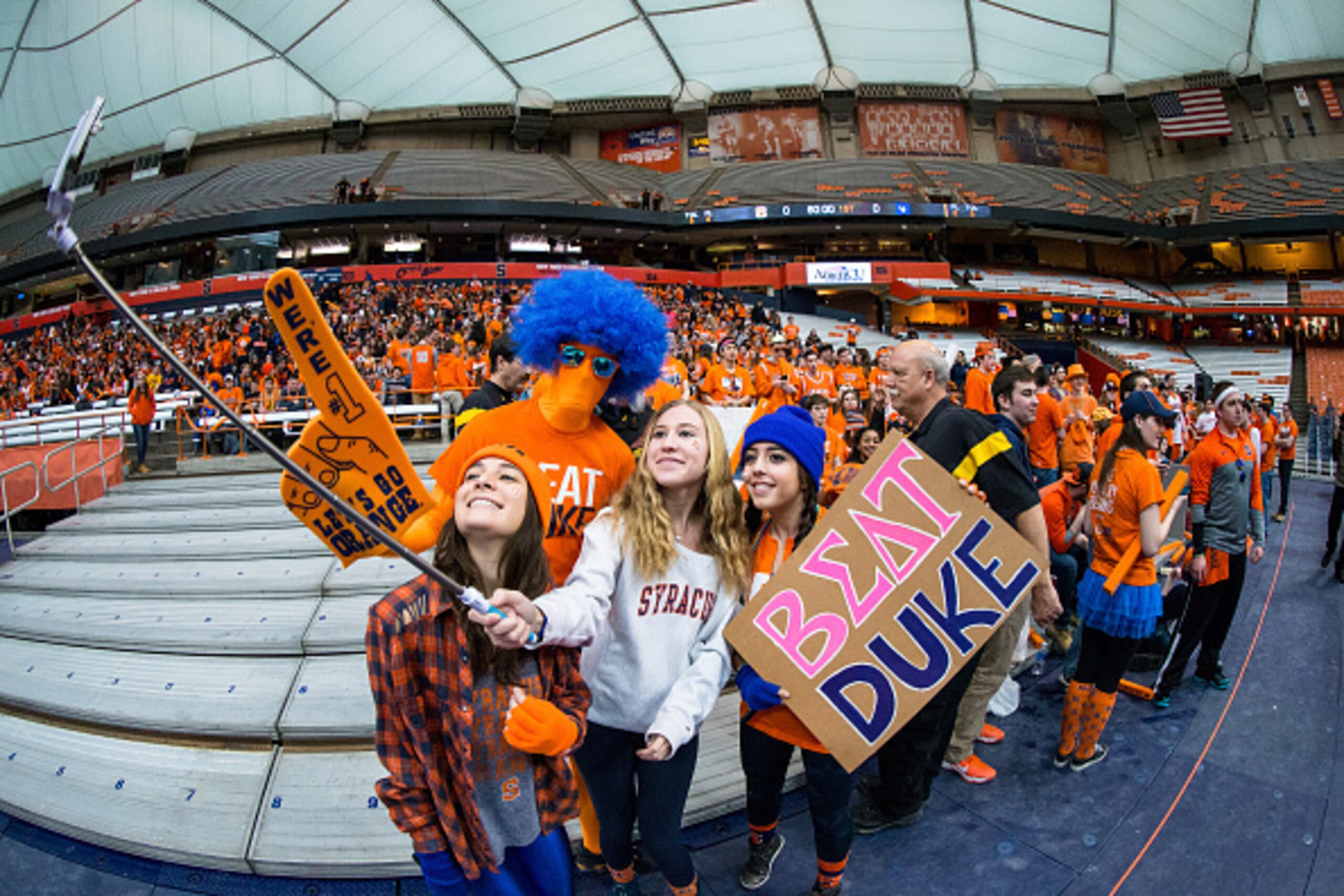 SYRACUSE, NY - FEBRUARY 14:  Fans use a selfie stick to photograph the Syracuse Orange student section before the game against the Duke Blue Devils on February 14, 2015 at The Carrier Dome in Syracuse, New York.  (Photo by Brett Carlsen/Getty Images)