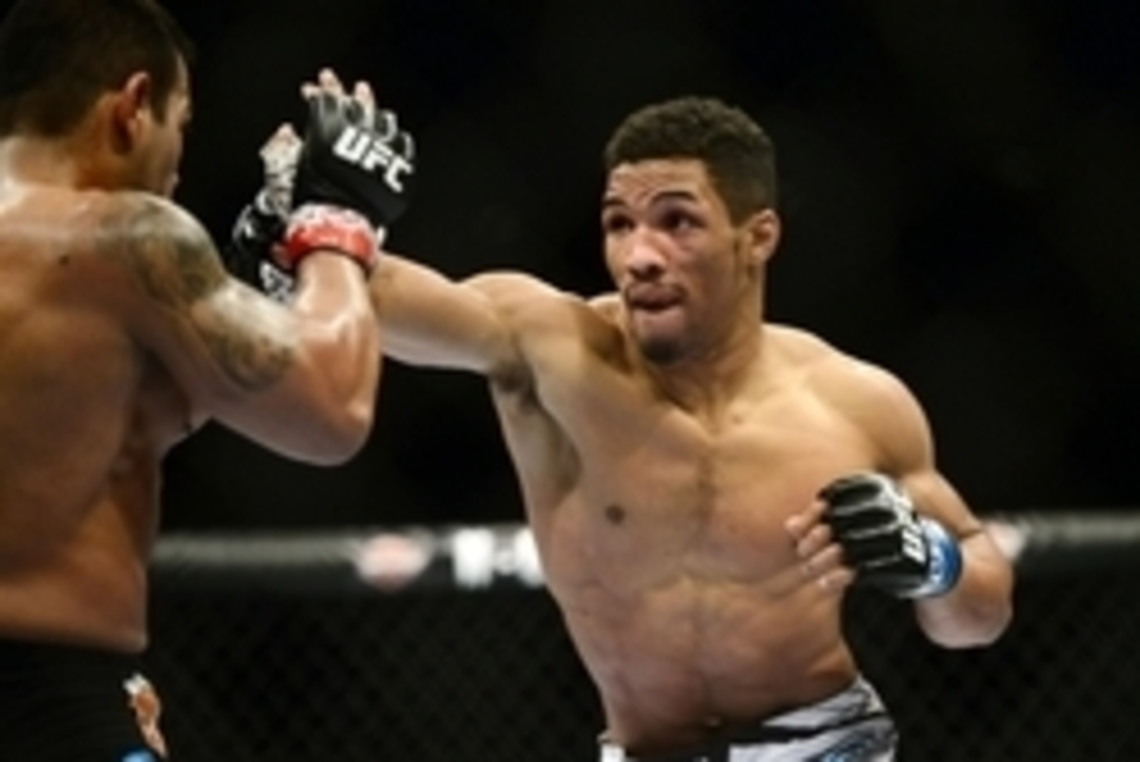 Feb 14, 2015; Broomfield, CO, USA; Kevin Lee (blue) and Michel Prazeres (red) compete during UFC Fight Night at the 1stBANK Center. Mandatory Credit: Ron Chenoy-USA TODAY Sports