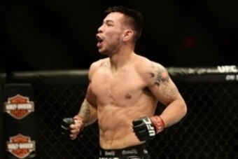 Feb 14, 2015; Broomfield, CO, USA; Ray Borg (red) celebrates his win over Chris Kelades (not pictured) during UFC Fight Night at the 1stBANK Center. Mandatory Credit: Ron Chenoy-USA TODAY Sports