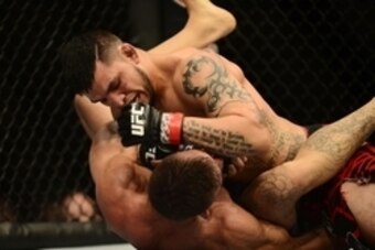 Feb 14, 2015; Broomfield, CO, USA; Rodrigo De Lima (blue) and Efrain Escudero (red) compete during UFC Fight Night at the 1stBANK Center. Mandatory Credit: Ron Chenoy-USA TODAY Sports