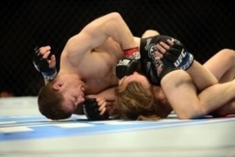 Feb 14, 2015; Broomfield, CO, USA; Zach Makovsky (red) and Timothy Elliott (blue) compete during UFC Fight Night at the 1stBANK Center. Mandatory Credit: Ron Chenoy-USA TODAY Sports