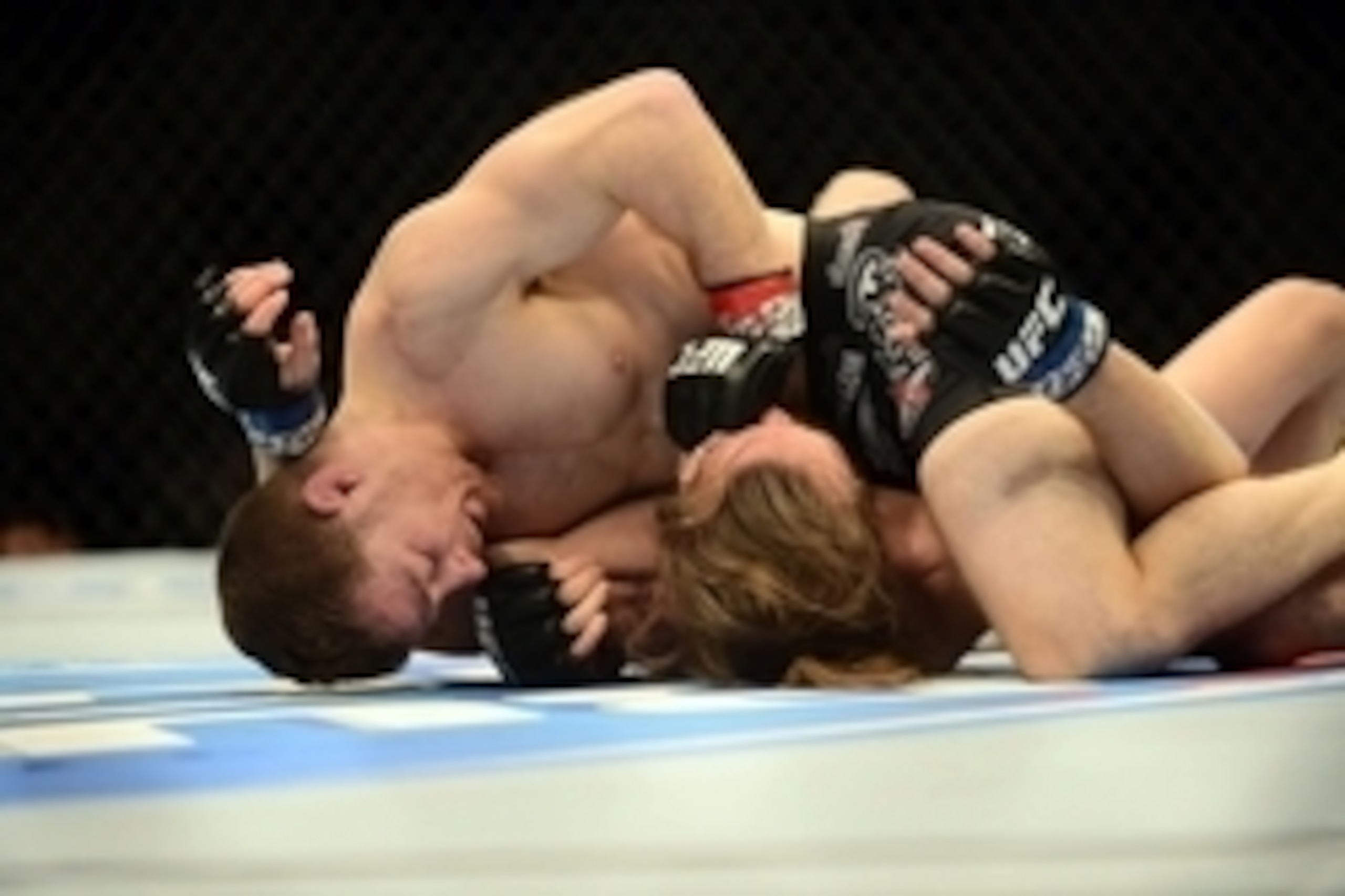 Feb 14, 2015; Broomfield, CO, USA; Zach Makovsky (red) and Timothy Elliott (blue) compete during UFC Fight Night at the 1stBANK Center. Mandatory Credit: Ron Chenoy-USA TODAY Sports Feb 14, 2015; Broomfield, CO, USA; Zach Makovsky (red) and Timothy Elliott (blue) compete during UFC Fight Night at the 1stBANK Center. Mandatory Credit: Ron Chenoy-USA TODAY Sports