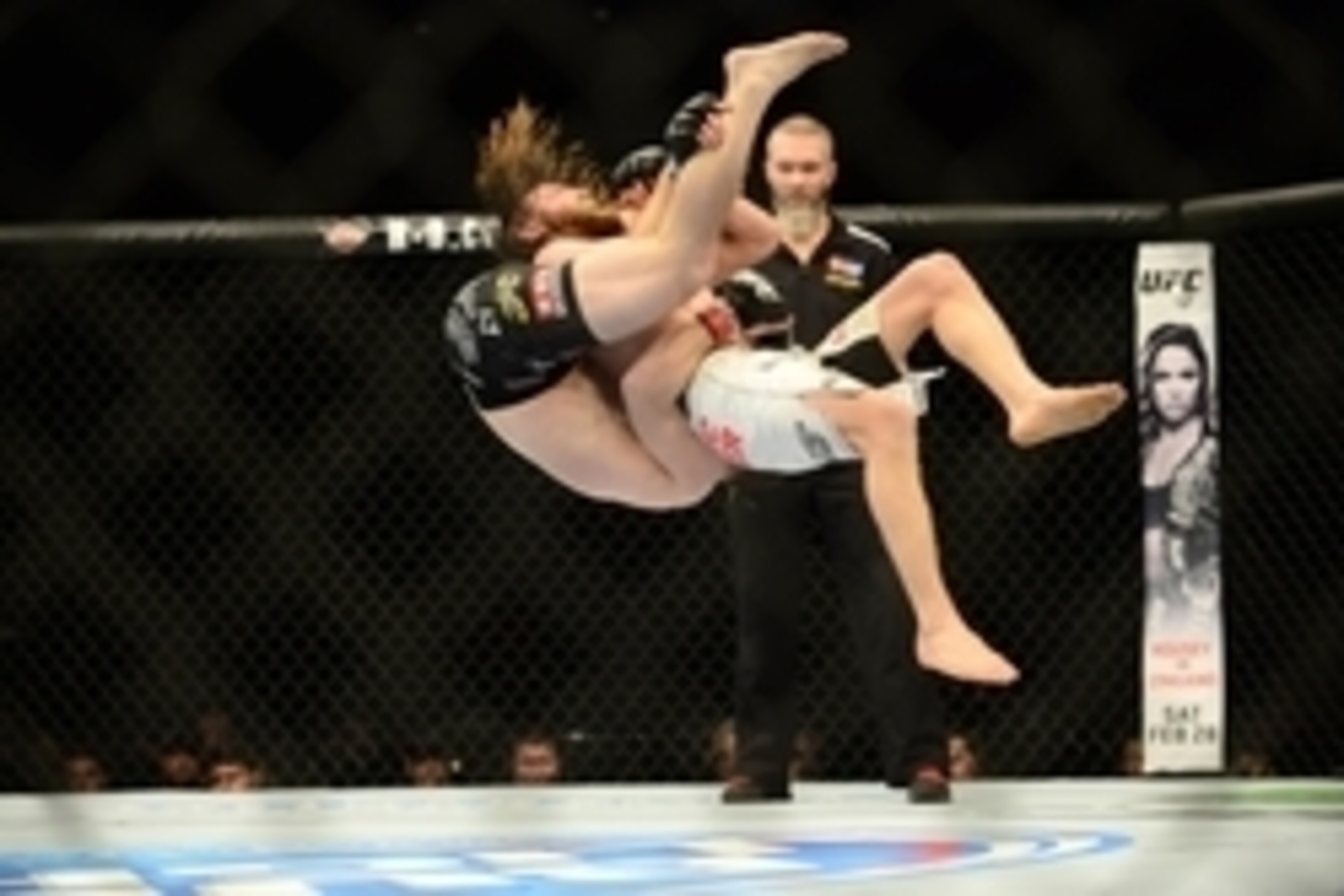 Feb 14, 2015; Broomfield, CO, USA; Zach Makovsky (red) is taken down by Timothy Elliott (blue) during UFC Fight Night at the 1stBANK Center. Mandatory Credit: Ron Chenoy-USA TODAY Sports