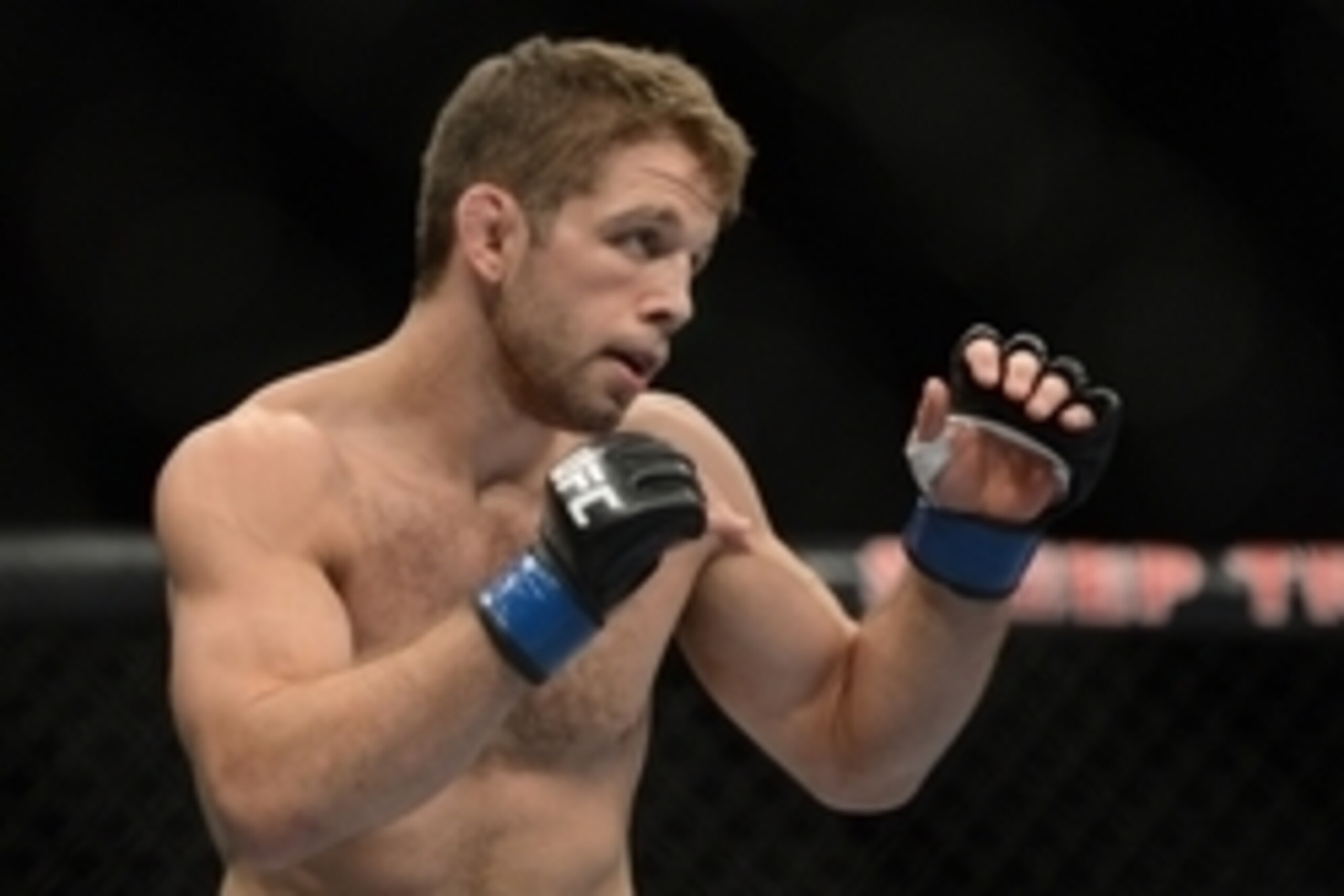 December 14, 2013; Sacramento, CA, USA; Nik Lentz (blue gloves) fights Chad Mendes (red gloves) during the featherweight bout of the UFC on FOX 9 at Sleep Train Arena. Mendes defeated Lentz. Mandatory Credit: Kyle Terada-USA TODAY Sports