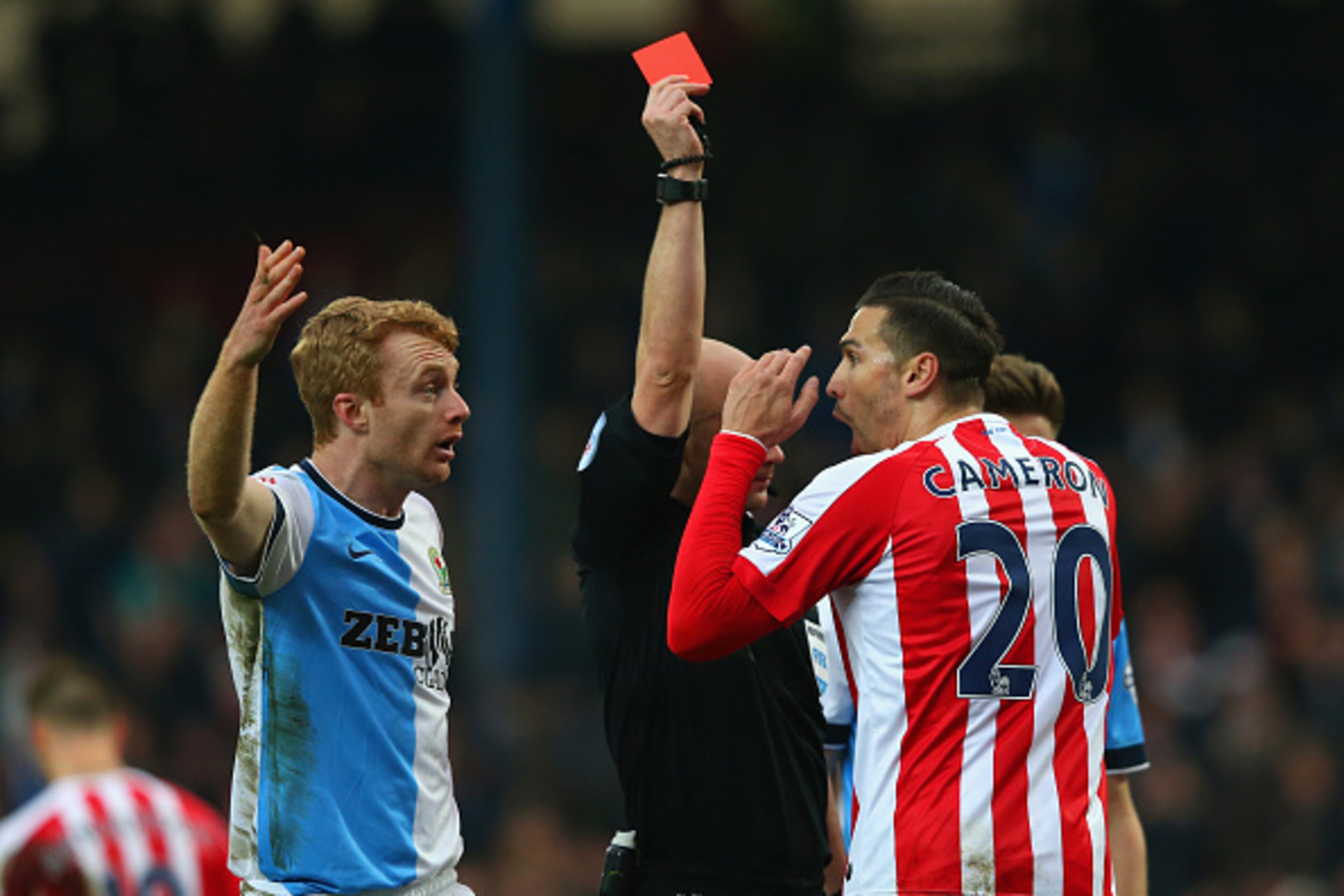 BLACKBURN, ENGLAND - FEBRUARY 14:  Referee Anthony Taylor shows Geoff Cameron of Stoke City a red card for a foul on Joshua King of Blackburn (not pictured) during the FA Cup Fifth Round match between Blackburn Rovers and Stoke City at Ewood park on Febru