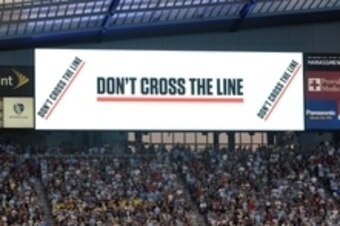 Jul 31, 2013; Kansas City, KS, USA; A general view of the don't cross the line campaign on the video boards before the 2013 MLS All Star Game at Sporting Park. Mandatory Credit: Denny Medley-USA TODAY Sports