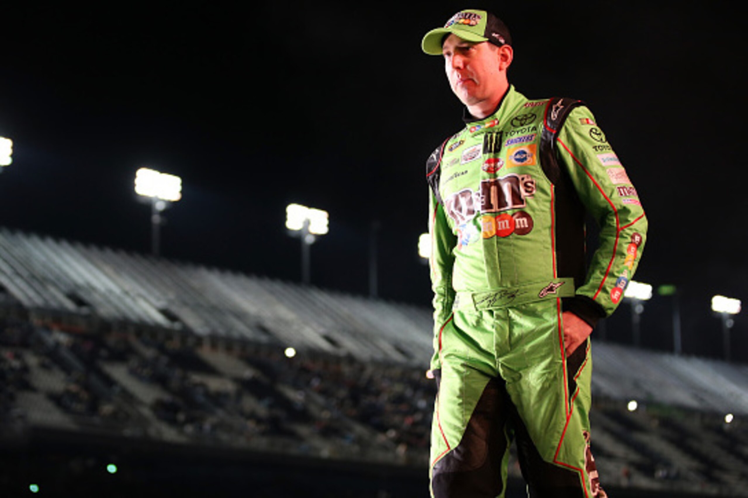 DAYTONA BEACH, FL - FEBRUARY 14: Kyle Busch, driver of the #18 M&M's Crispy Toyota, walks on stage during driver introductions prior to the start of the 3rd Annual Sprint Unlimited at Daytona at Daytona International Speedway on February 14, 2015 in Dayto