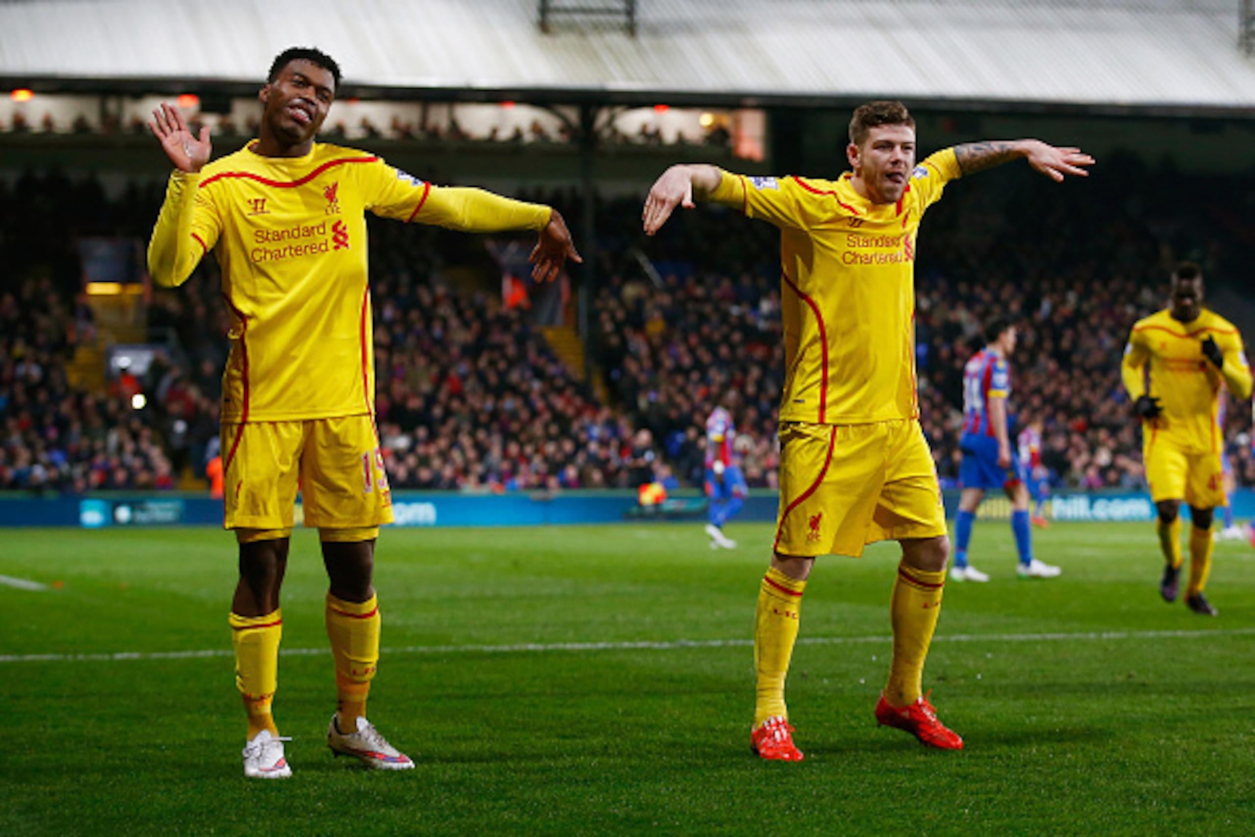 LONDON, ENGLAND - FEBRUARY 14:  Daniel Sturridge of Liverpool (L) celebrates scoring their first goal with Alberto Moreno of Liverpool during the FA Cup fifth round match between Crystal Palace and Liverpool at Selhurst Park on February 14, 2015 in London