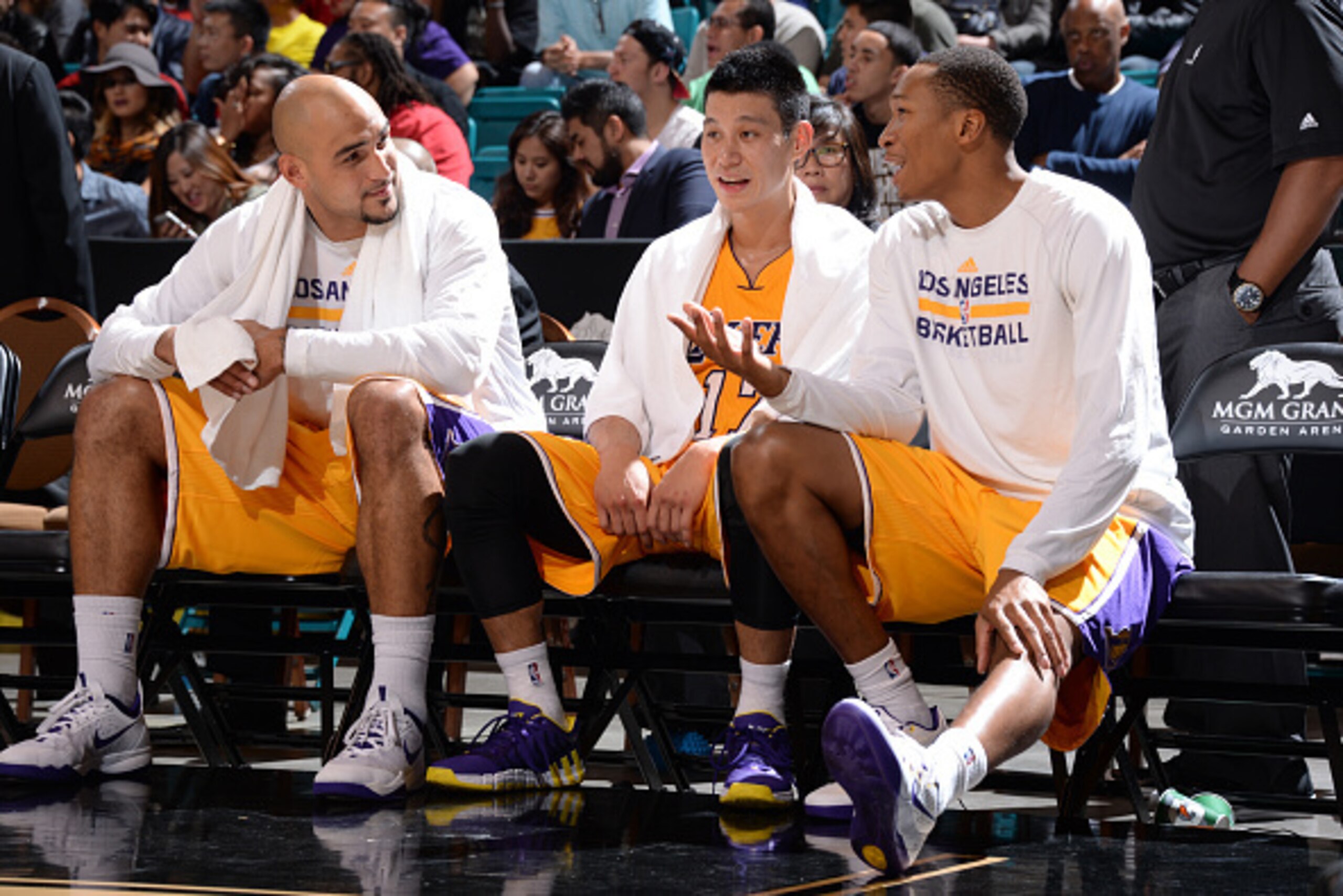 LAS VEGAS, NV - OCTOBER 24: Robert Sacre #50 of the Los Angeles Lakers, Jeremy Lin #17 of the Los Angeles Lakers and Wesley Johnson #11 of the Los Angeles Lakers sit on the bench during a game against the Sacramento Kings on October 24, 2014 at the MGM Gr