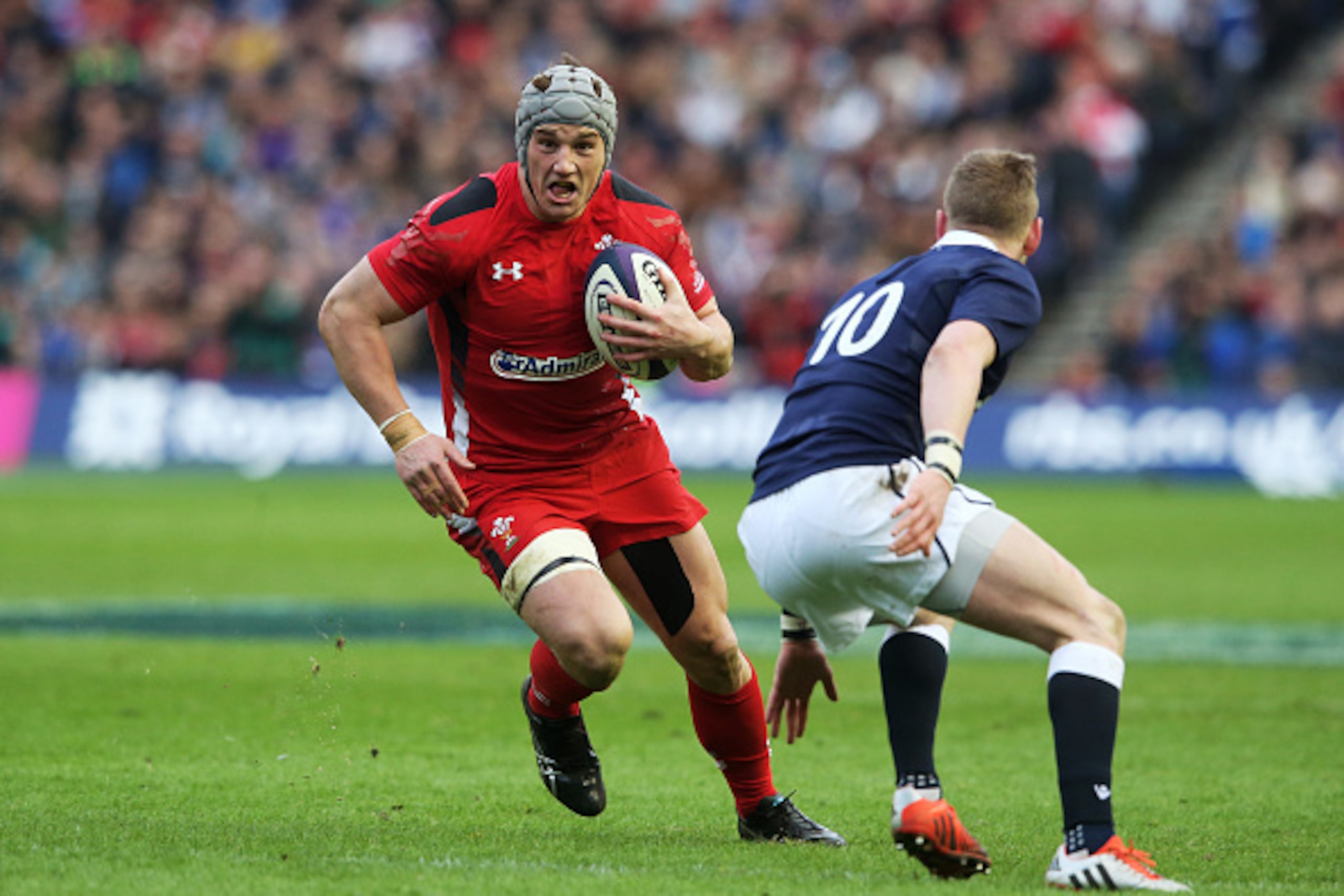 EDINBURGH, SCOTLAND - FEBRUARY 15:  Jonathan Davies of Wales takes on Finn Russell of Scotland during the RBS Six Nations match between Scotland and Wales at Murrayfield Stadium on February 15, 2015 in Edinburgh, Scotland.  (Photo by David Rogers/Getty Im