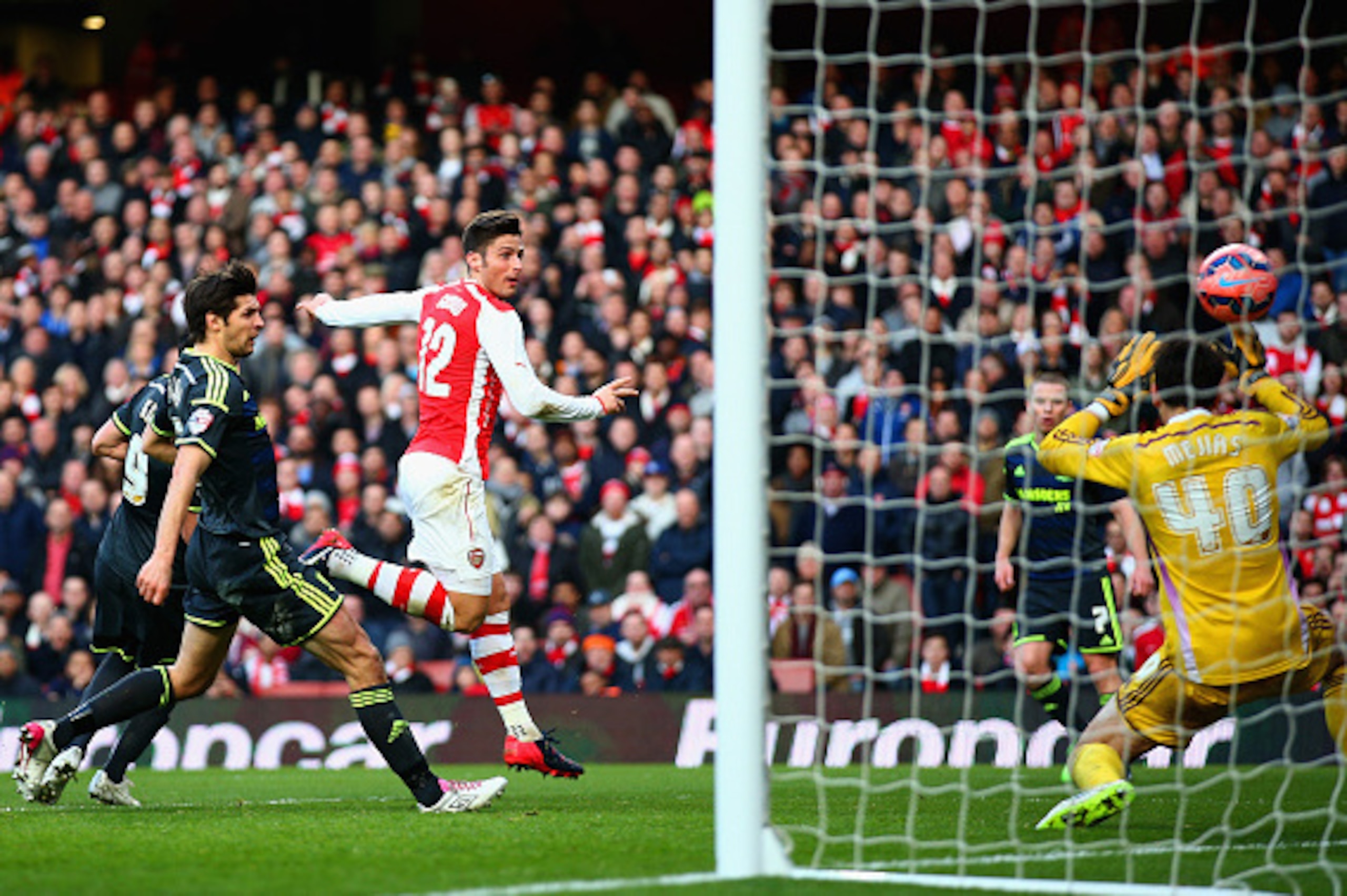 LONDON, ENGLAND - FEBRUARY 15: Olivier Giroud of Arsenal scores their second goal during the FA Cup fifth round match between Arsenal and Middlesbrough at Emirates Stadium on February 15, 2015 in London, England. (Photo by Paul Gilham/Getty Images) LONDON, ENGLAND - FEBRUARY 15: Olivier Giroud of Arsenal scores their second goal during the FA Cup fifth round match between Arsenal and Middlesbrough at Emirates Stadium on February 15, 2015 in London, England. (Photo by Paul Gilham/Getty Images)
