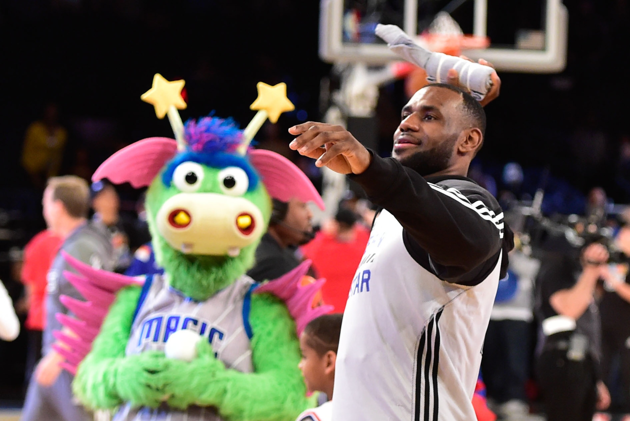 Feb 14, 2015; New York, NY, USA; Eastern Conference forward LeBron James of the Cleveland Cavaliers (23, right) throws t-shirts into the crowd during practice at Madison Square Garden. Mandatory Credit: Bob Donnan-USA TODAY Sports