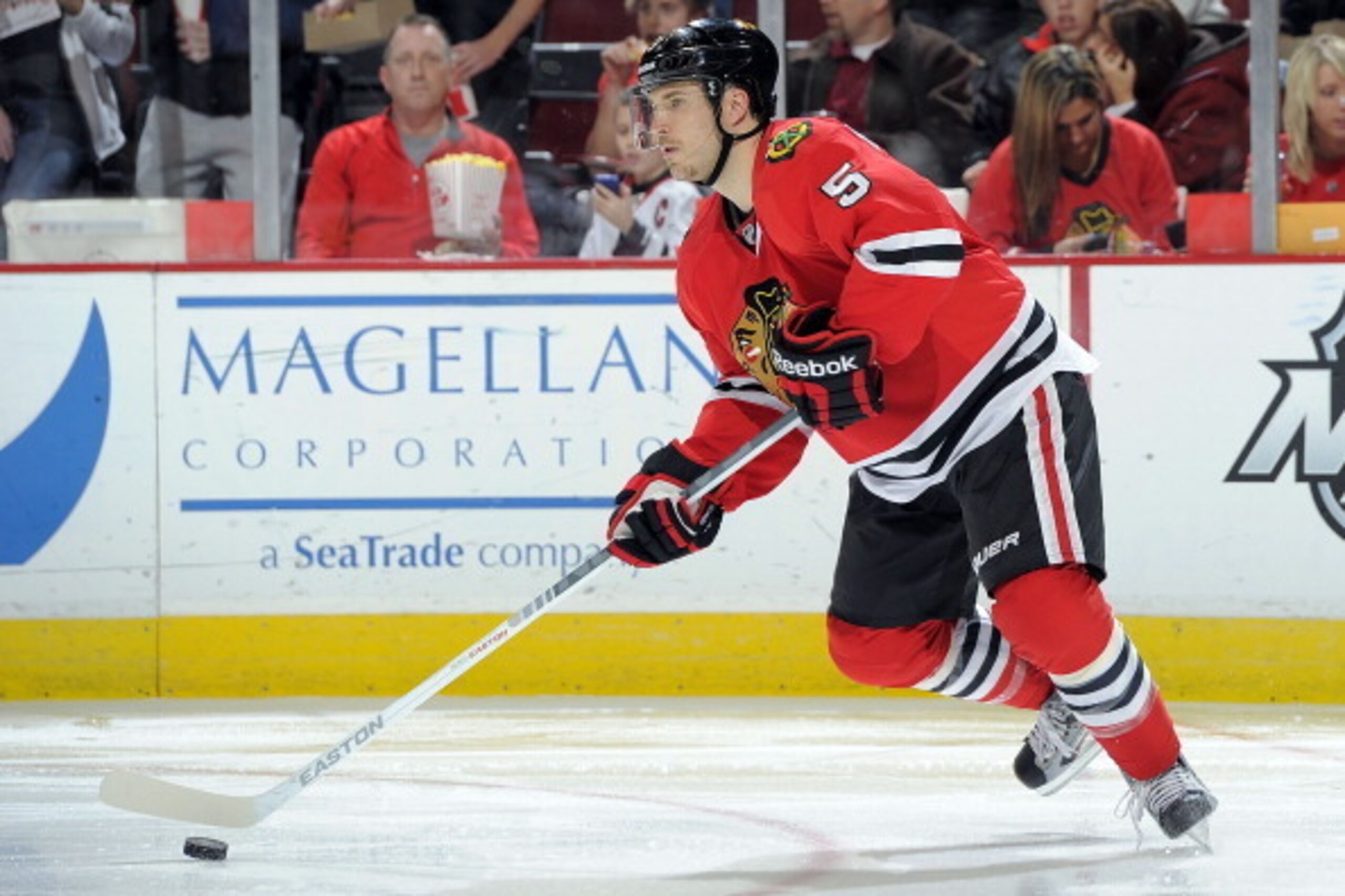 CHICAGO, IL - DECEMBER 26:  Steve Montador #5 of the Chicago Blackhawks takes control of the puck during the NHL game against the Columbus Blue Jackets on December 26, 2011 at the United Center in Chicago, Illinois. (Photo by Bill Smith/NHLI via Getty Ima