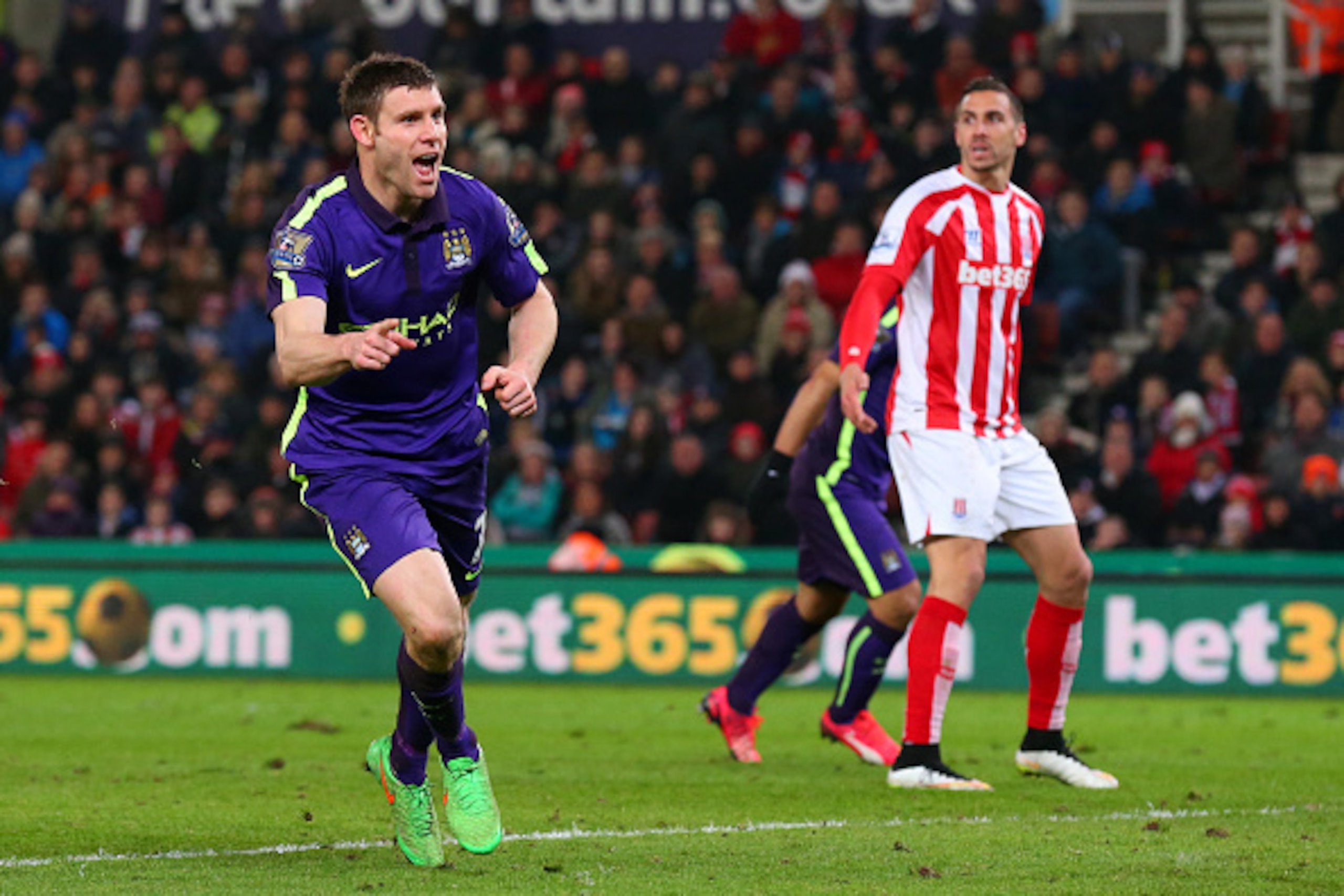 STOKE ON TRENT, ENGLAND - FEBRUARY 11:  James Milner of Manchester City celebrates after scoring his team's second goal during the Barclays Premier League match between Stoke City and Manchester City at Britannia Stadium on February 11, 2015 in Stoke on T