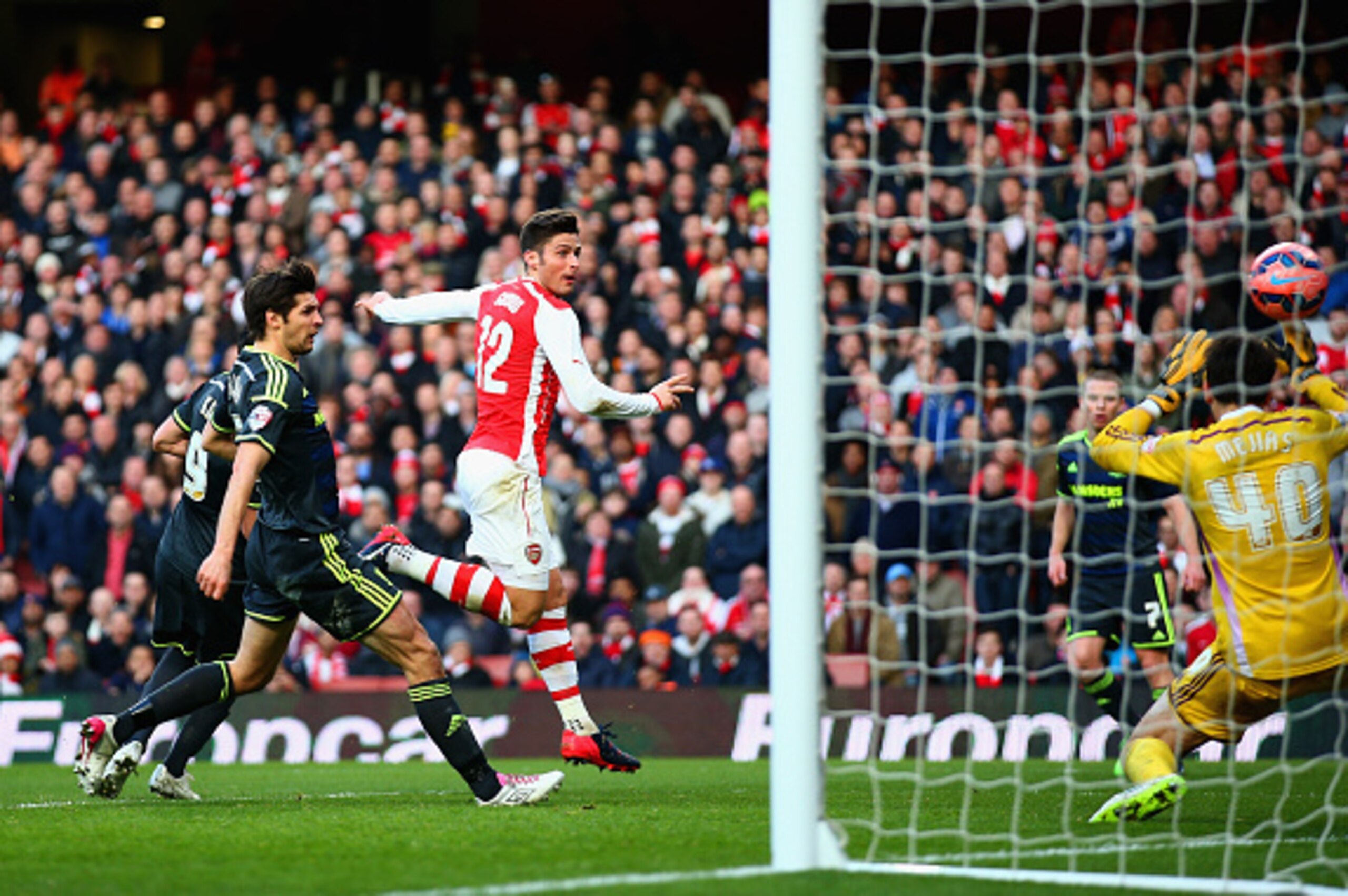 LONDON, ENGLAND - FEBRUARY 15:  Olivier Giroud of Arsenal scores their second goal during the FA Cup fifth round match between Arsenal and Middlesbrough at Emirates Stadium on February 15, 2015 in London, England.  (Photo by Paul Gilham/Getty Images)
