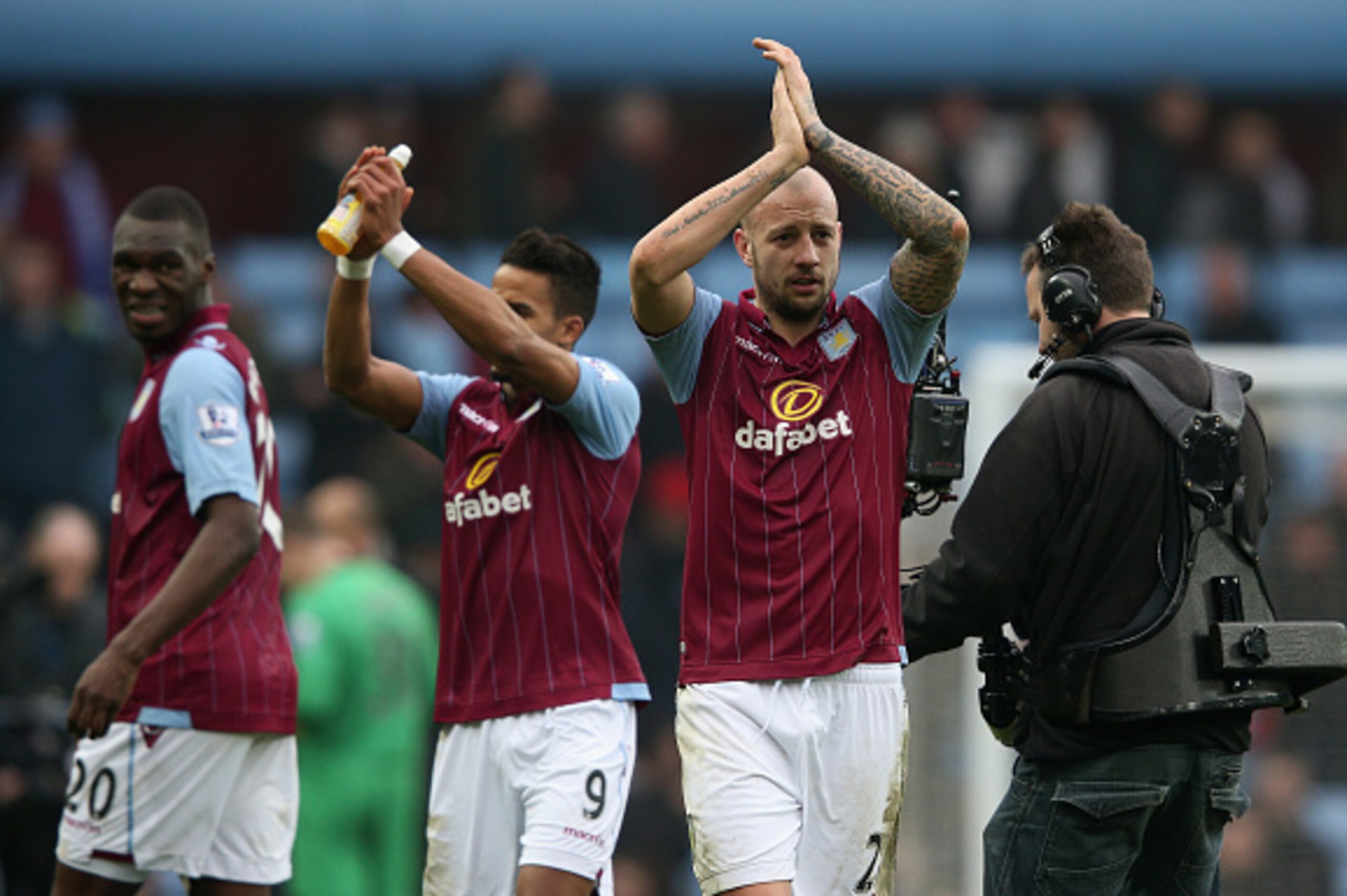 BIRMINGHAM, ENGLAND - FEBRUARY 15:  Alan Hutton of Aston Villa (R) applauds the fans after the FA Cup fifth round match between Aston Villa and Leicester City at Villa Park on February 15, 2015 in Birmingham, England.  (Photo by Clive Mason/Getty Images)