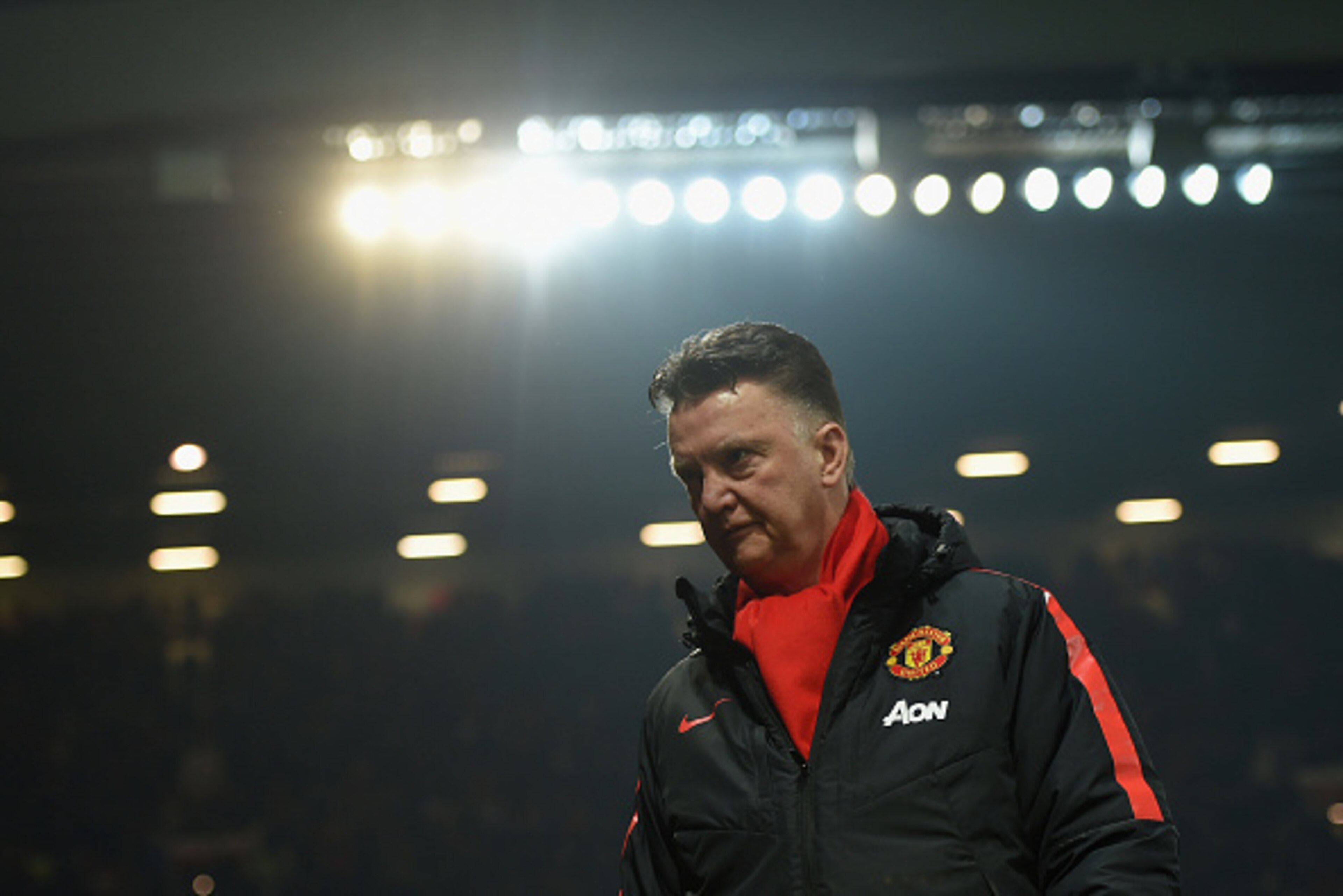 MANCHESTER, ENGLAND - FEBRUARY 11:  Louis van Gaal, manager of Manchester United takes his seat during the Barclays Premier League match between Manchester United and Burnley at Old Trafford on February 11, 2015 in Manchester, England.  (Photo by Michael 