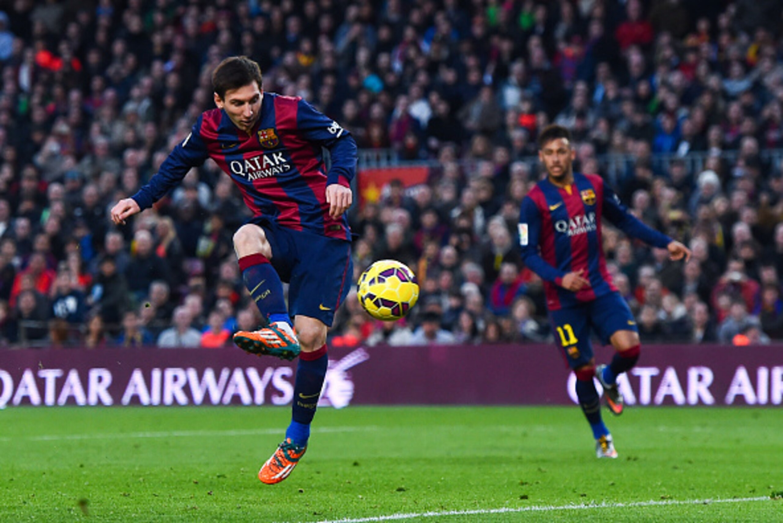 BARCELONA, SPAIN - FEBRUARY 15:  Lionel Messi of FC Barcelona scores his team's third goal during the La Liga match between FC Barcelona and Levante UD at Camp Nou on February 15, 2015 in Barcelona, Spain.  (Photo by David Ramos/Getty Images)