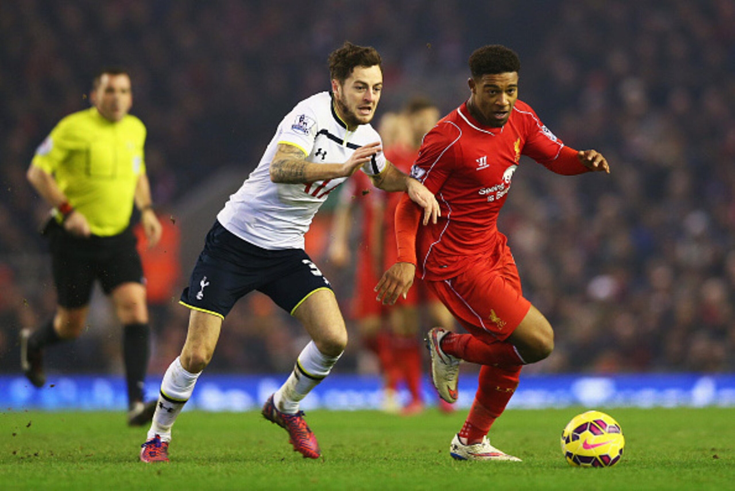 LIVERPOOL, ENGLAND - FEBRUARY 10: Jordon Ibe of Liverpool takes on Ryan Mason of Tottenham Hotspur during the Barclays Premier League match between Liverpool and Tottenham Hotspur at Anfield on February 10, 2015 in Liverpool, England. (Photo by Clive Br LIVERPOOL, ENGLAND - FEBRUARY 10: Jordon Ibe of Liverpool takes on Ryan Mason of Tottenham Hotspur during the Barclays Premier League match between Liverpool and Tottenham Hotspur at Anfield on February 10, 2015 in Liverpool, England. (Photo by Clive Br