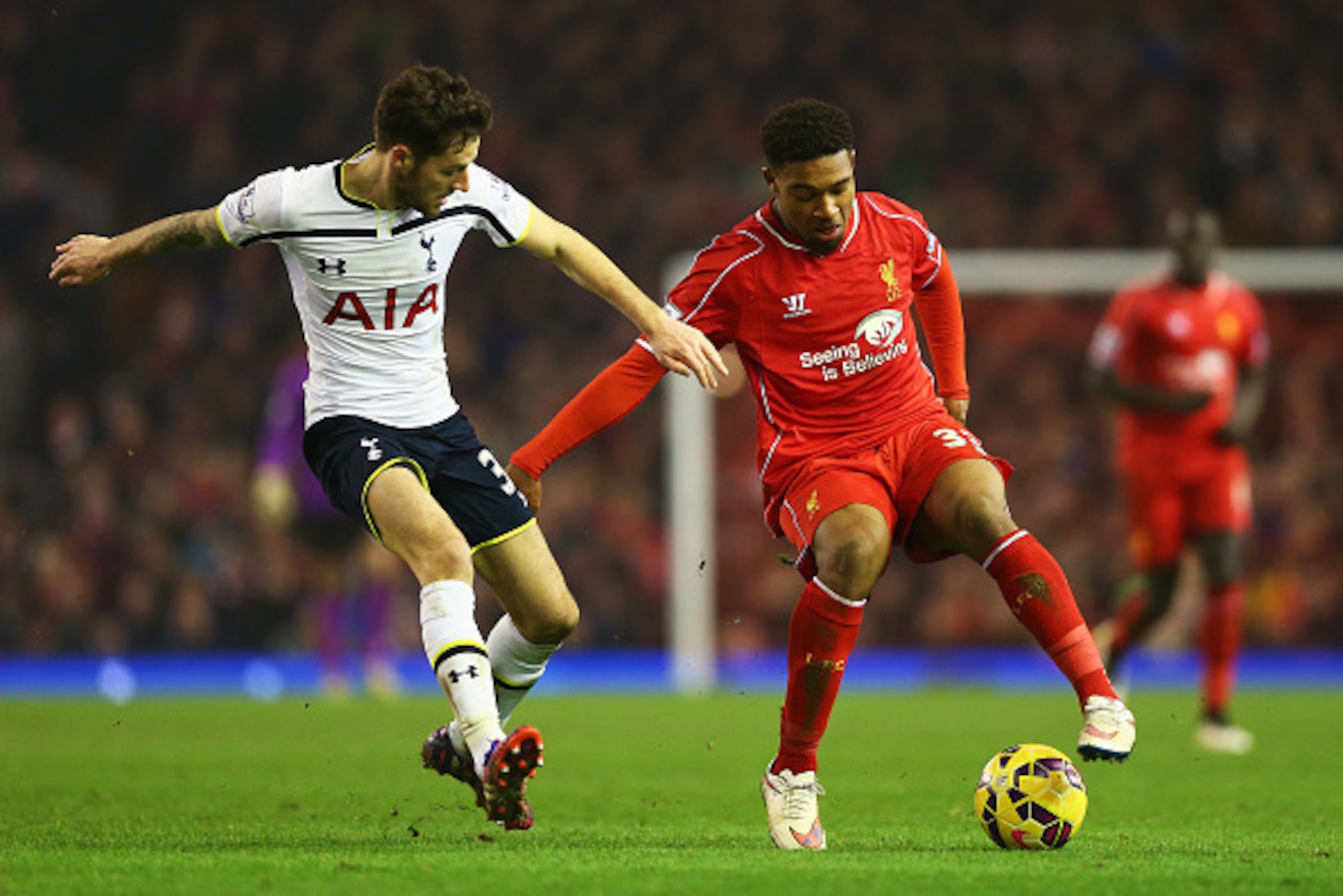 LIVERPOOL, ENGLAND - FEBRUARY 10: Jordon Ibe of Liverpool takes on Ryan Mason of Tottenham Hotspur during the Barclays Premier League match between Liverpool and Tottenham Hotspur at Anfield on February 10, 2015 in Liverpool, England. (Photo by Clive Br LIVERPOOL, ENGLAND - FEBRUARY 10: Jordon Ibe of Liverpool takes on Ryan Mason of Tottenham Hotspur during the Barclays Premier League match between Liverpool and Tottenham Hotspur at Anfield on February 10, 2015 in Liverpool, England. (Photo by Clive Br