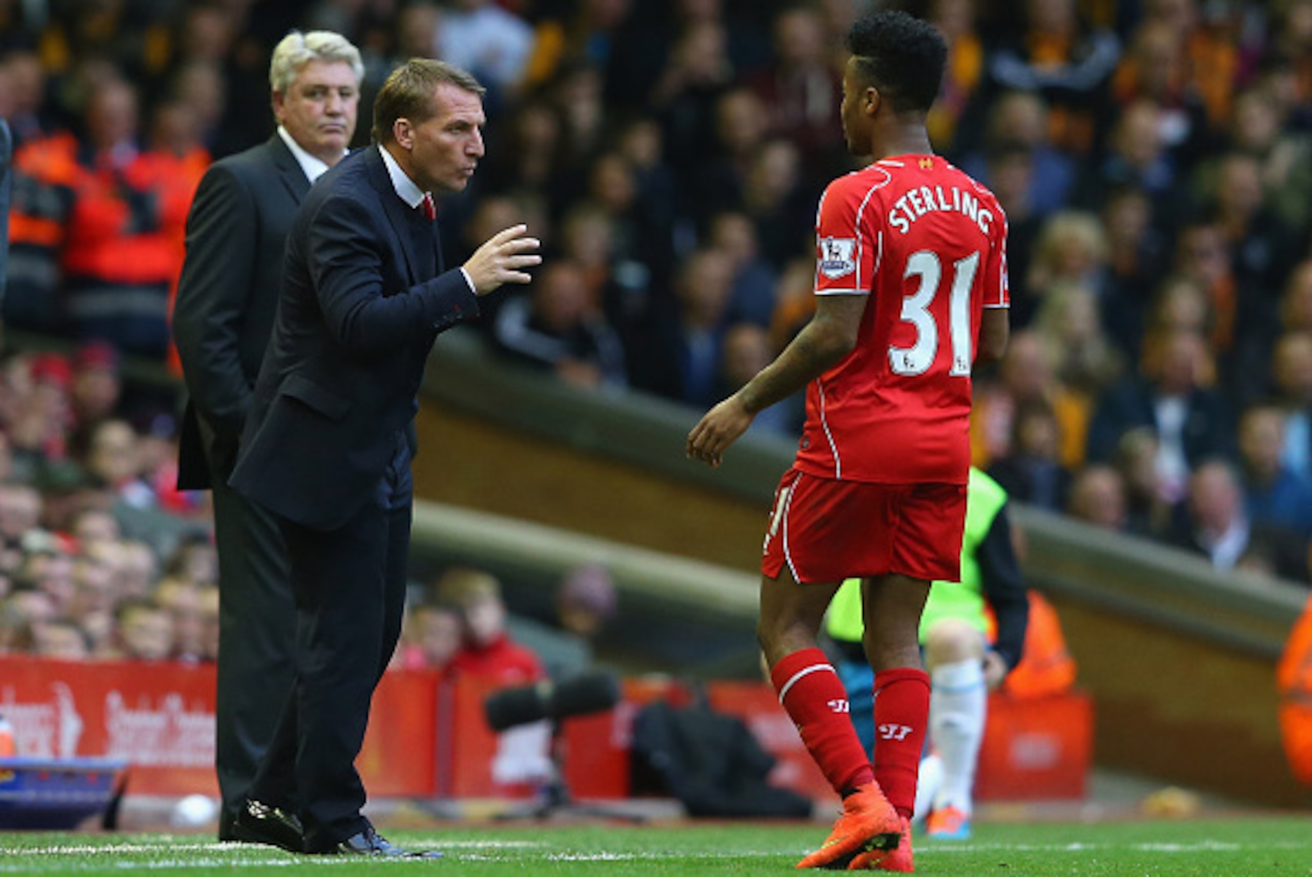 LIVERPOOL, ENGLAND - OCTOBER 25: Brendan Rodgers the manager of Liverpool talks with Raheem Sterling during the Barclays Premier League match between Liverpool and Hull City at Anfield on October 25, 2014 in Liverpool, England. (Photo by Alex Livesey/Ge LIVERPOOL, ENGLAND - OCTOBER 25: Brendan Rodgers the manager of Liverpool talks with Raheem Sterling during the Barclays Premier League match between Liverpool and Hull City at Anfield on October 25, 2014 in Liverpool, England. (Photo by Alex Livesey/Ge