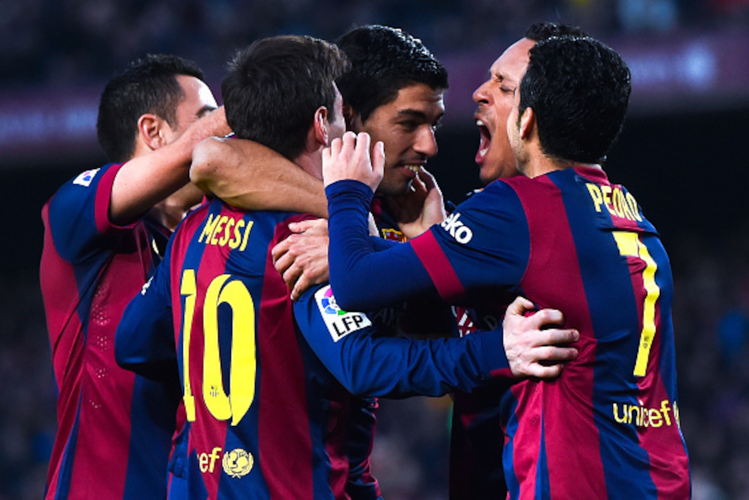 BARCELONA, SPAIN - FEBRUARY 15:  Luis Suarez of FC Barcelona celebrates with his teammates after scoring his team's fifth goal during the La Liga match between FC Barcelona and Levante UD at Camp Nou on February 15, 2015 in Barcelona, Spain.  (Photo by Da