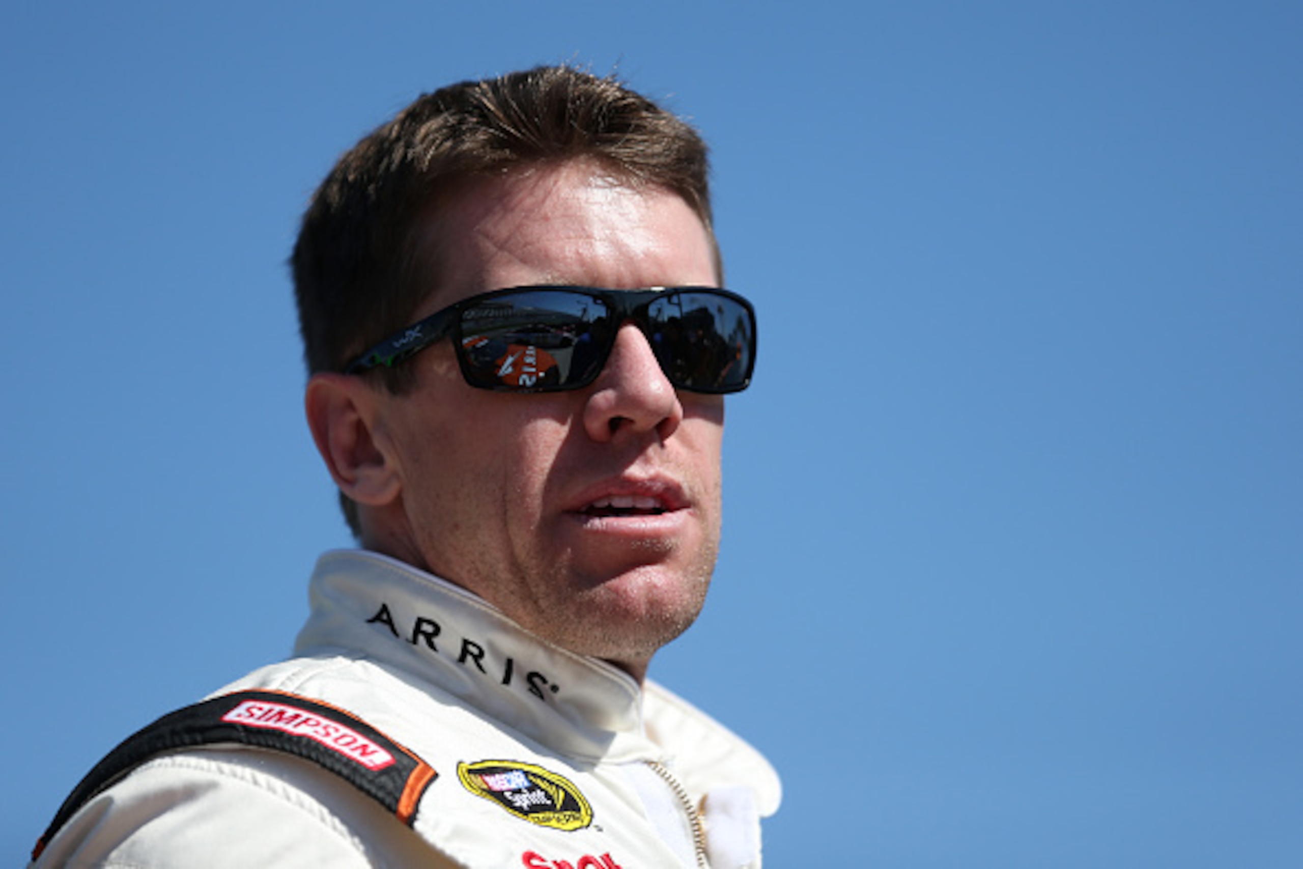 DAYTONA BEACH, FL - FEBRUARY 15:  Carl Edwards, driver of the #19 Arris Toyota, stands on the grid during qualifying for the 57th Annual Daytona 500 at Daytona International Speedway on February 15, 2015 in Daytona Beach, Florida.  (Photo by Sarah Glenn/G