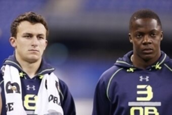 Feb 23, 2014; Indianapolis, IN, USA; Texas A&M quarterback Johnny Manziel (L) and Louisville Cardinals quarterback Teddy Bridgewater (R) look on during the 2014 NFL Combine at Lucas Oil Stadium. Mandatory Credit: Brian Spurlock-USA TODAY Sports